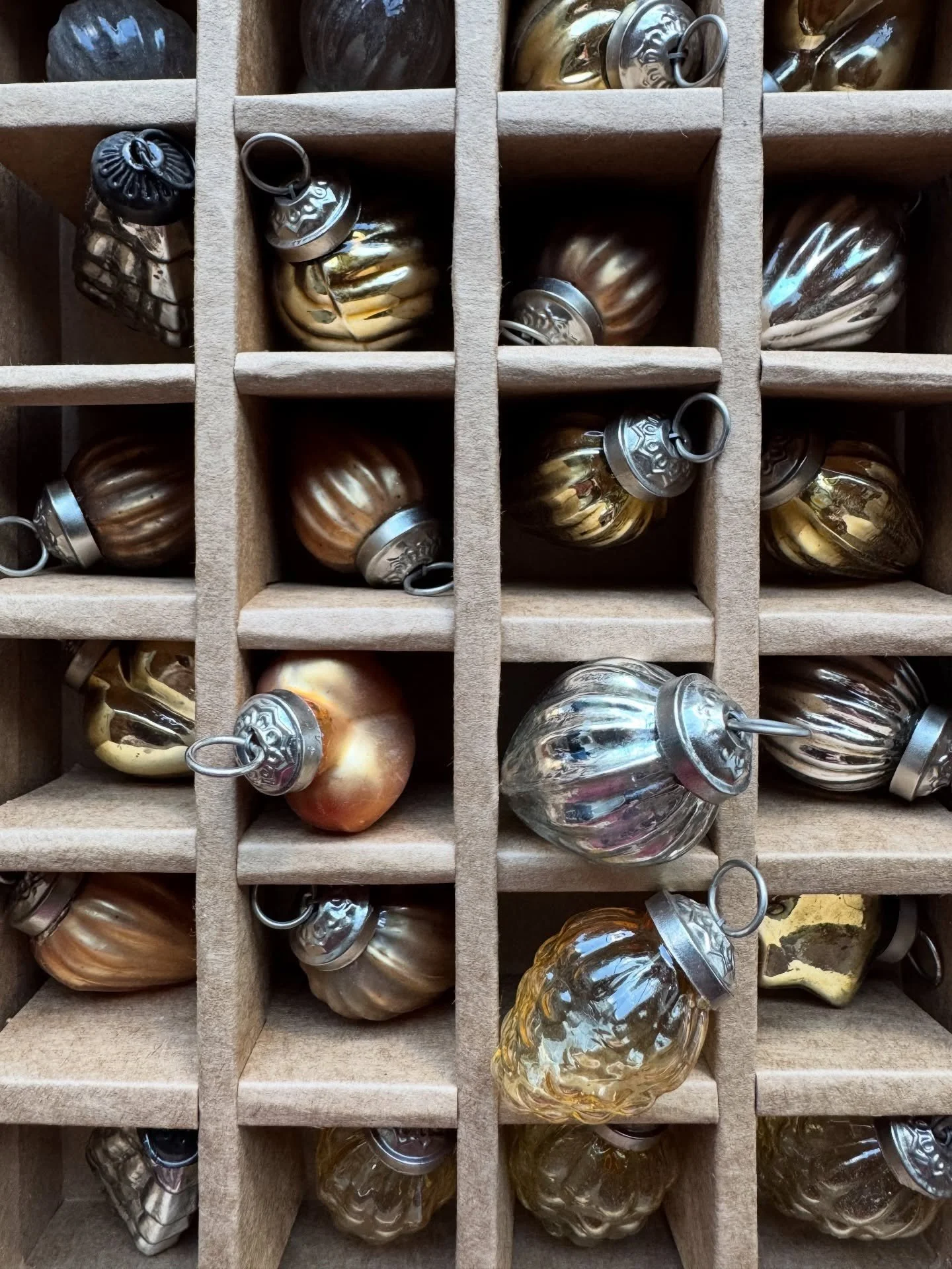 Vintage glass Christmas ornaments stored in individual compartments