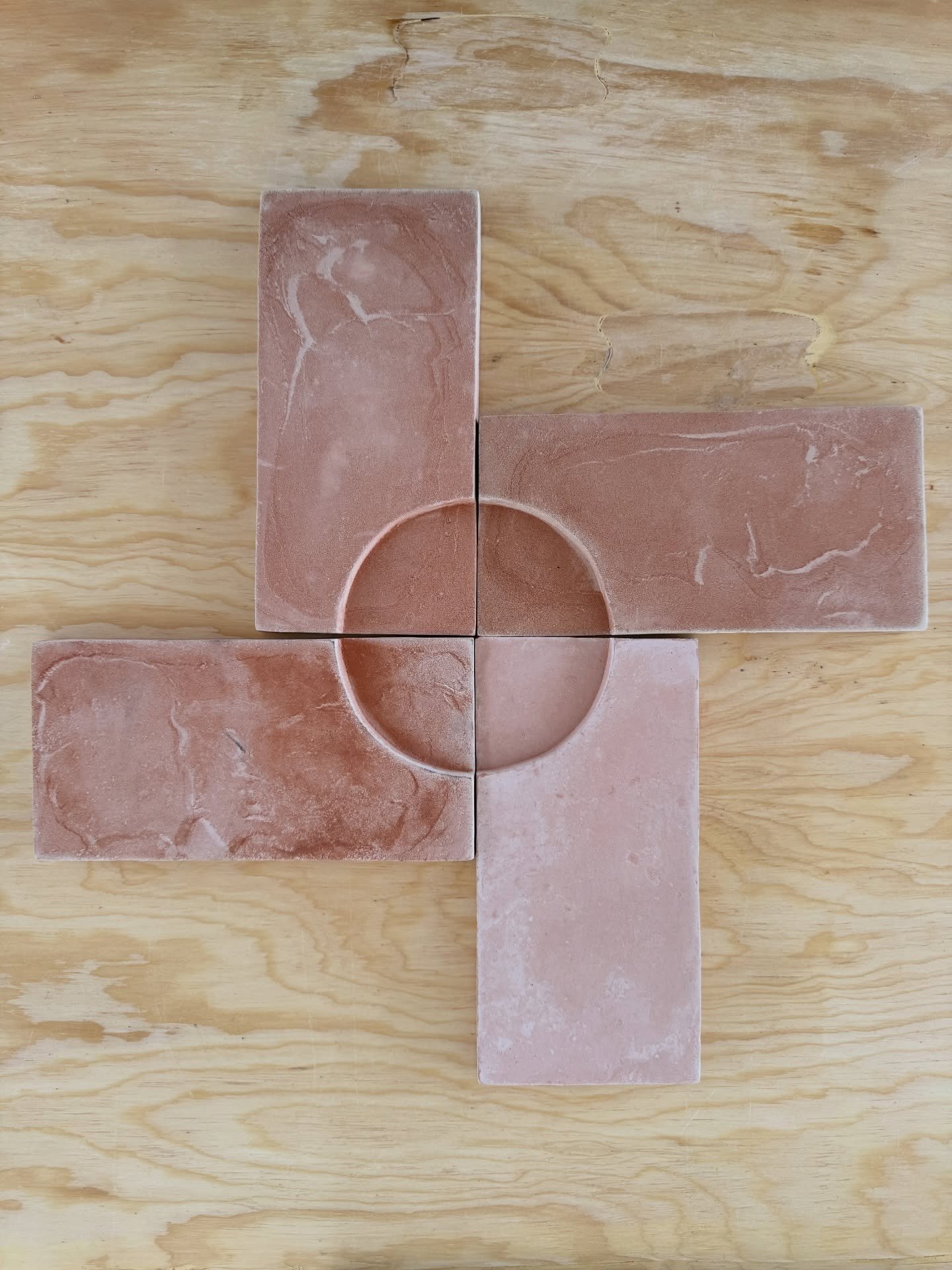 Pink stone samples arranged in a circular composition