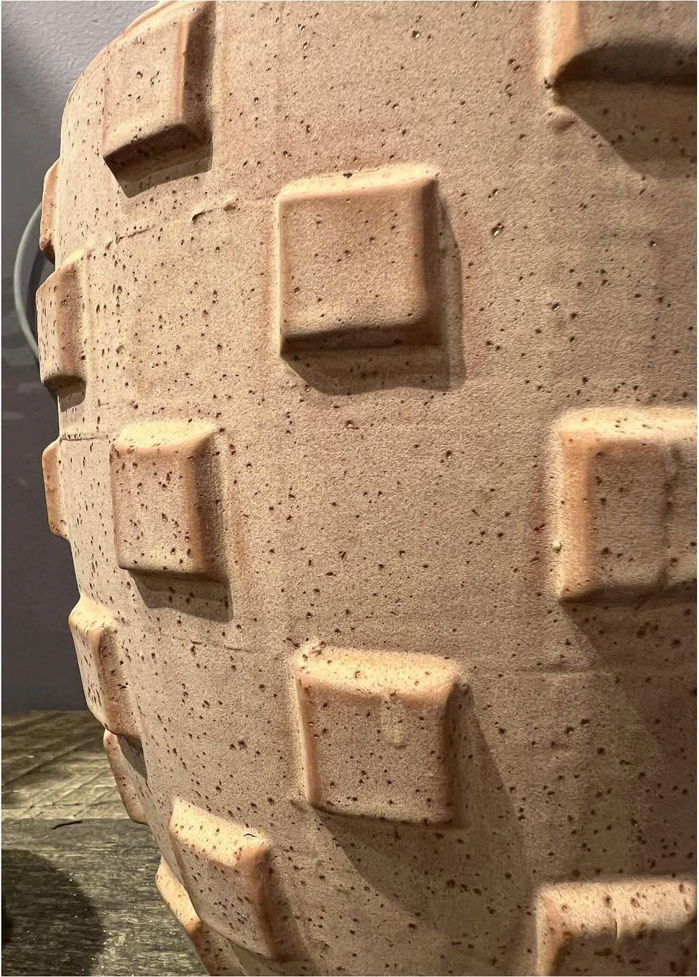 Textured terracotta planter with raised geometric square details
