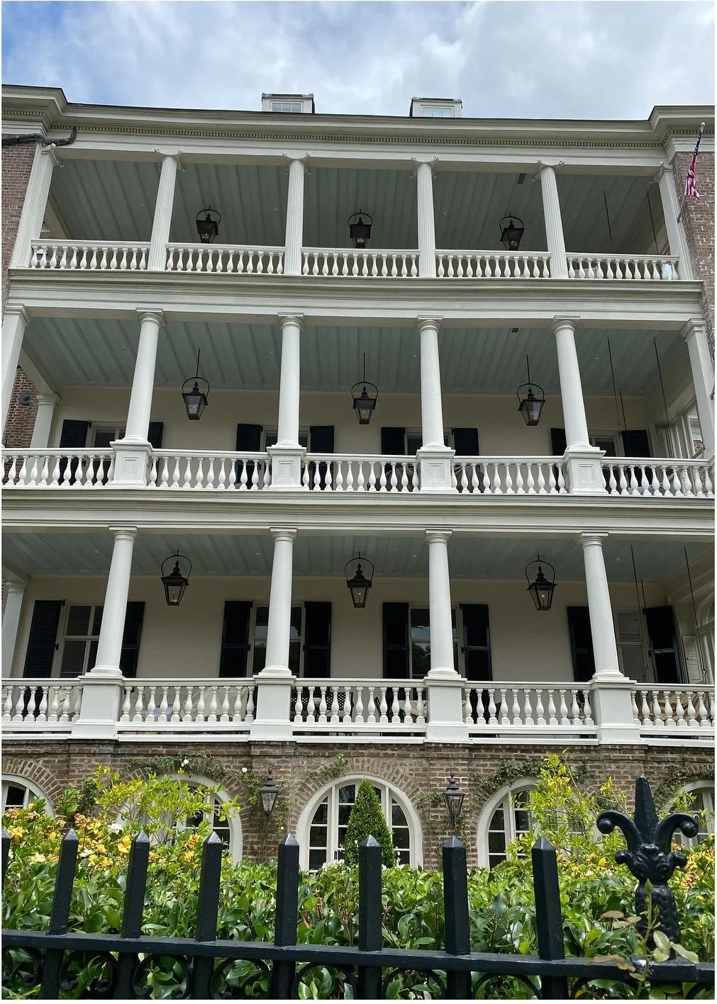 Large historic house with stacked white columned porches