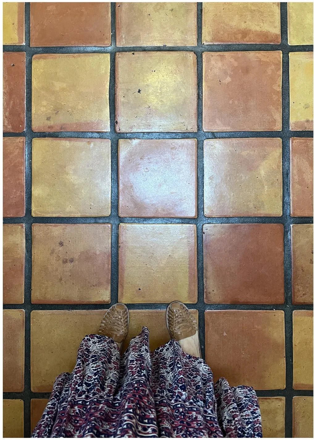 Restored warm terracotta floor tiles with subtle natural color variation