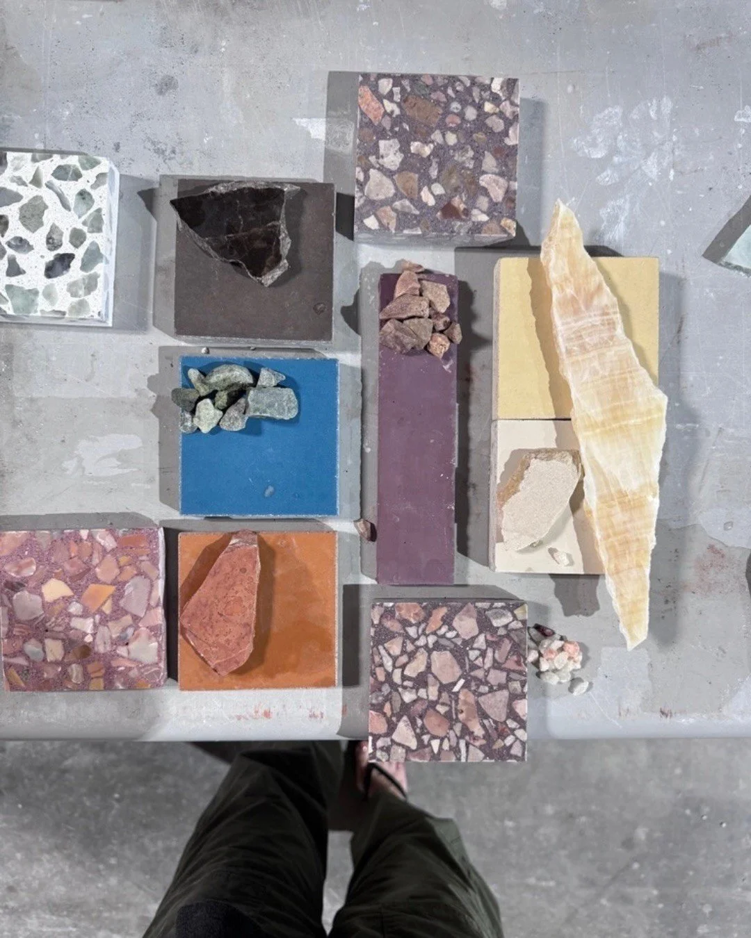 A coordinated board of tile, terrazzo, fabric and wood samples