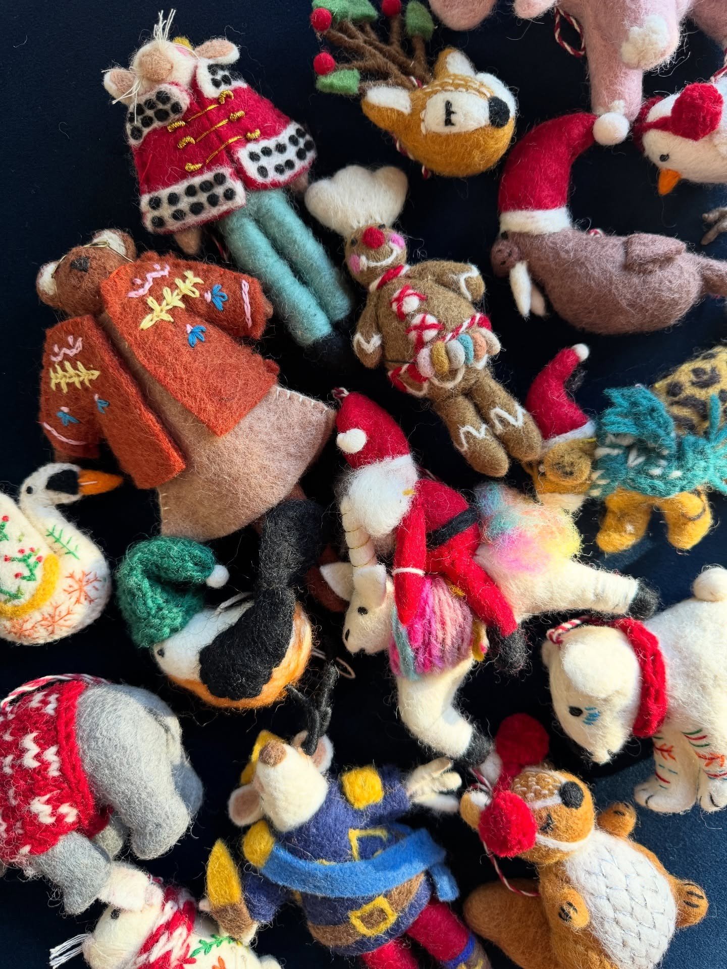 Colorful felt character ornaments arranged together