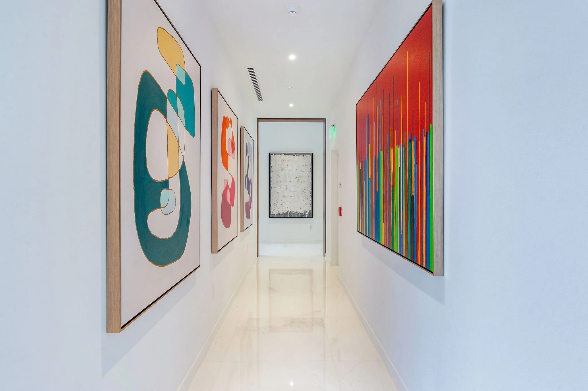 Aston Martin Residences PH6001C art-lined gallery hallway, Miami