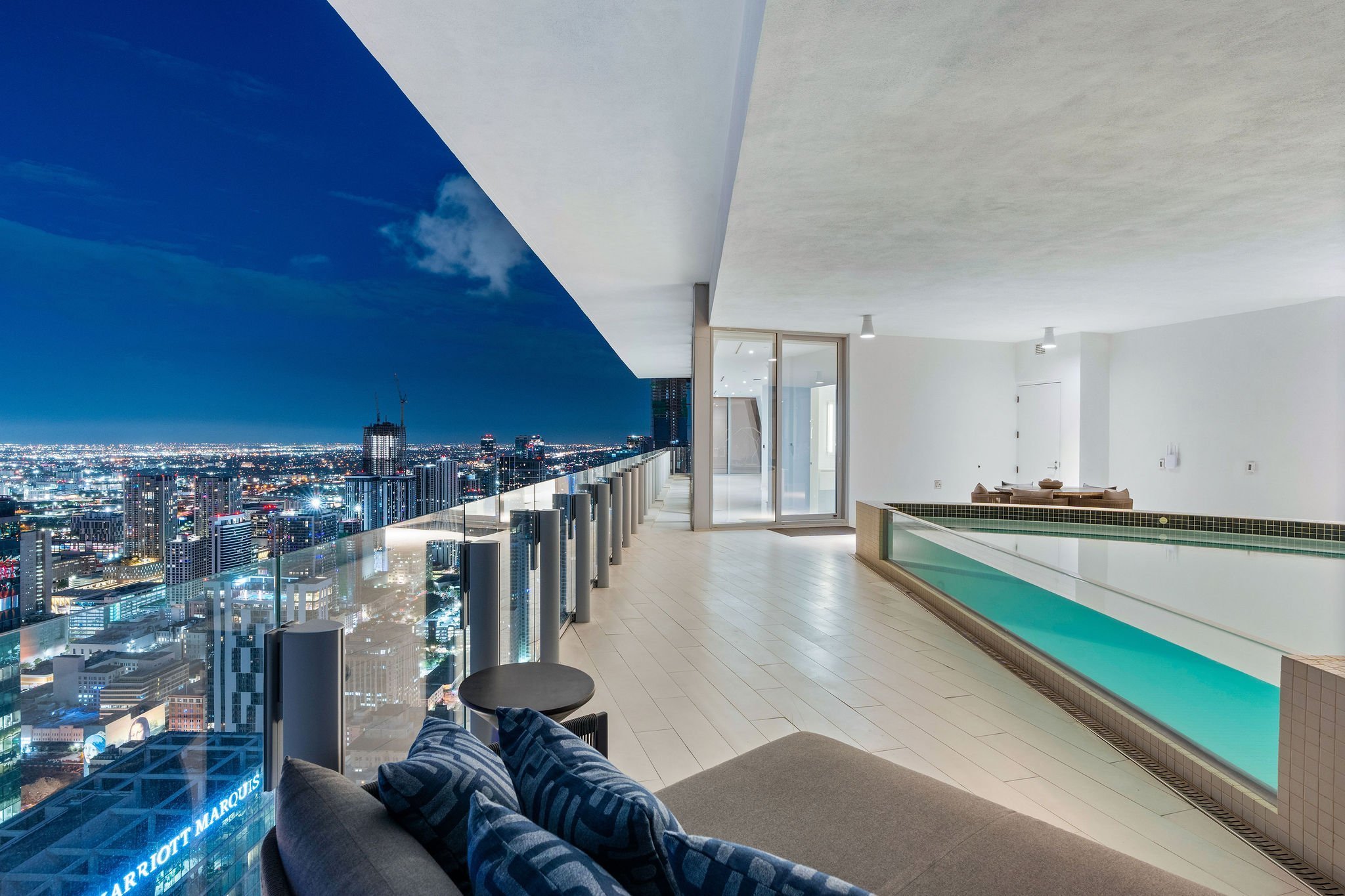 Aston Martin Residences PH6001C private pool terrace and illuminated Miami skyline at dusk, Miami