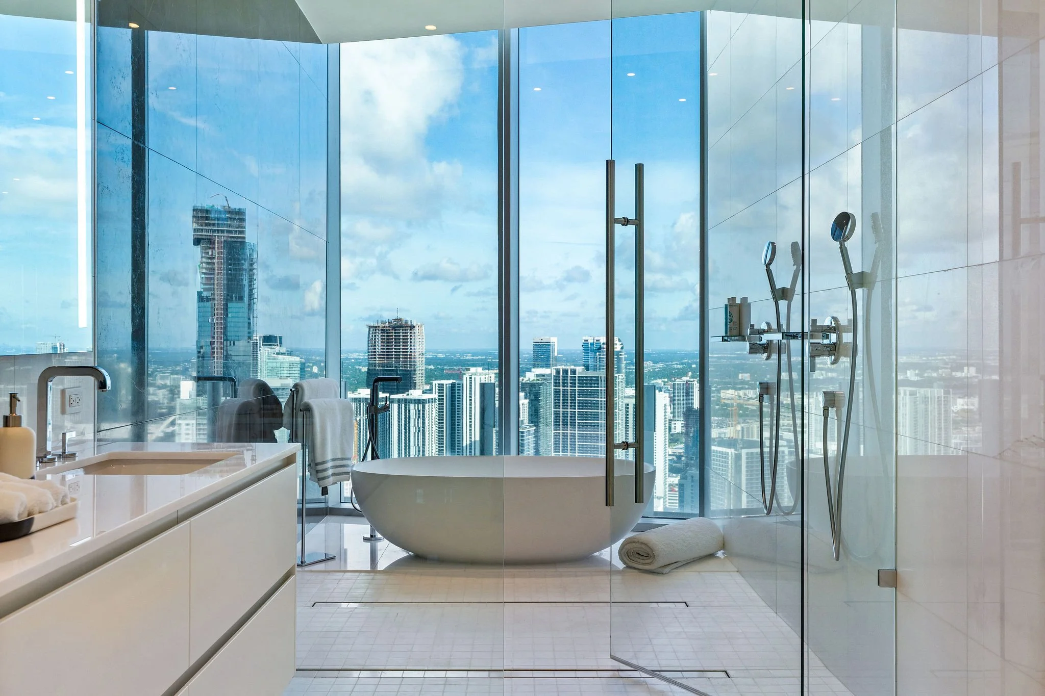 35-aston-martin-residences-ph6001c-bathtub-and-city-facing-glass-shower.jpg