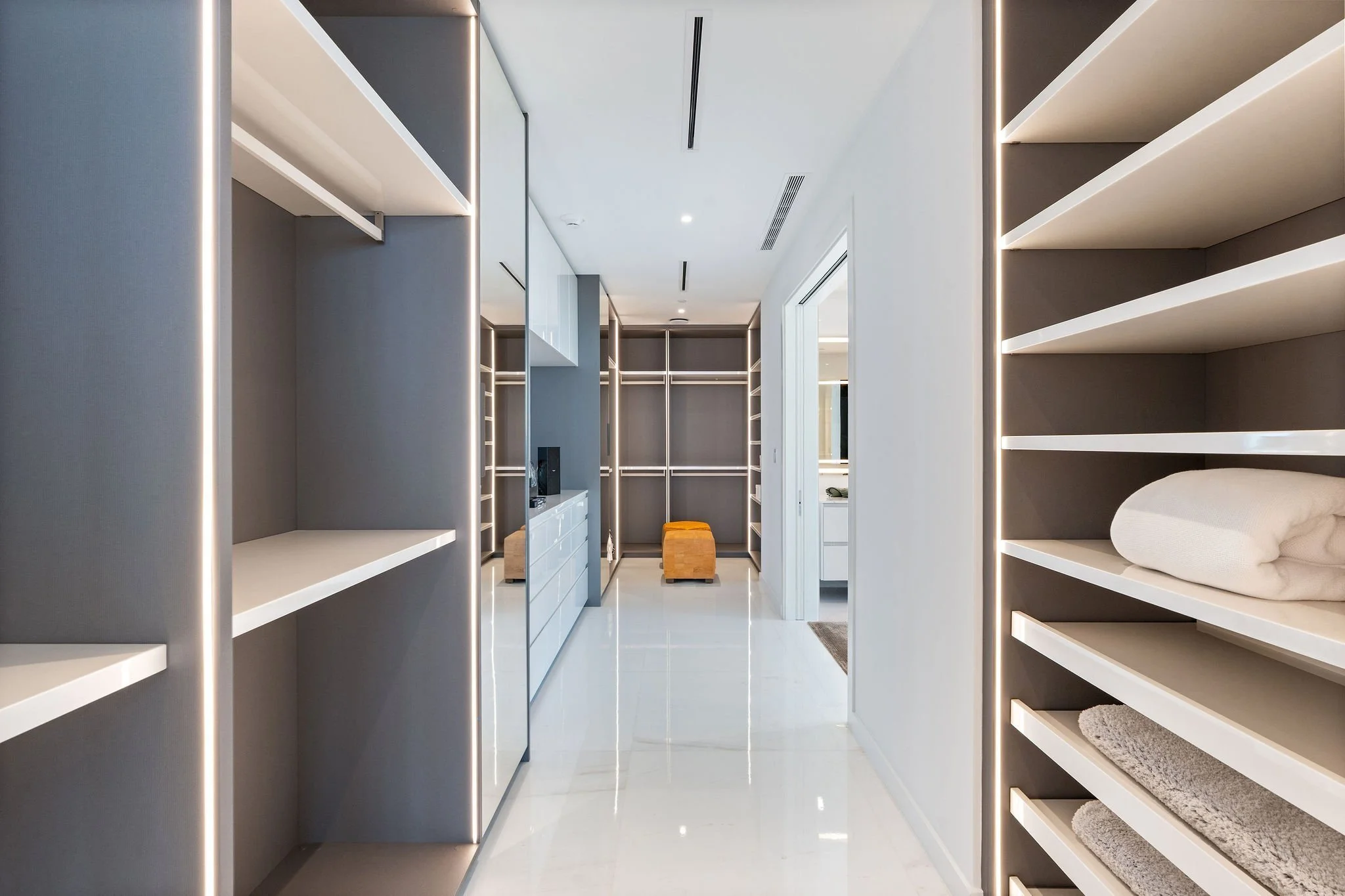 Aston Martin Residences PH6001C primary suite dressing room with fitted closets, Miami