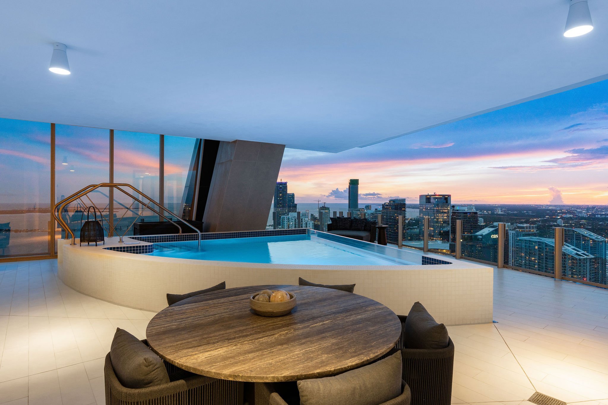 Aston Martin Residences PH6001C private pool and entertaining table at twilight, Miami