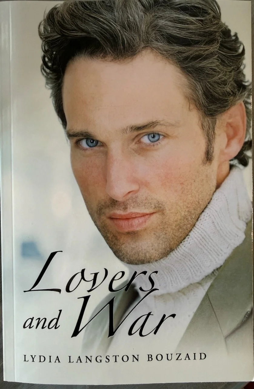 Lovers and War by Lydia Langston Bouzaid, book cover: a blue-eyed man in a cream turtleneck sweater