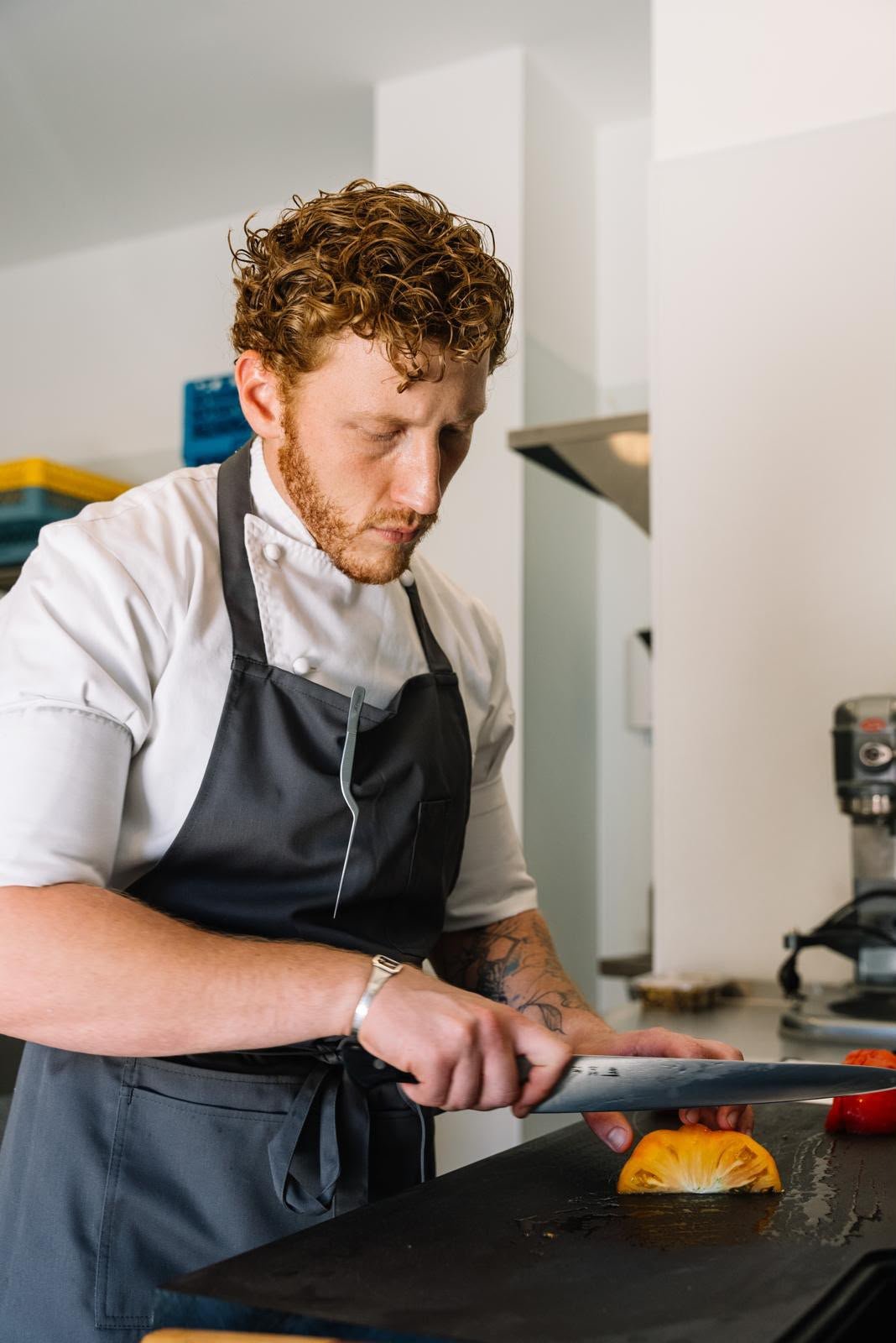Limonit chef preparing a seasonal tomato in the kitchen
