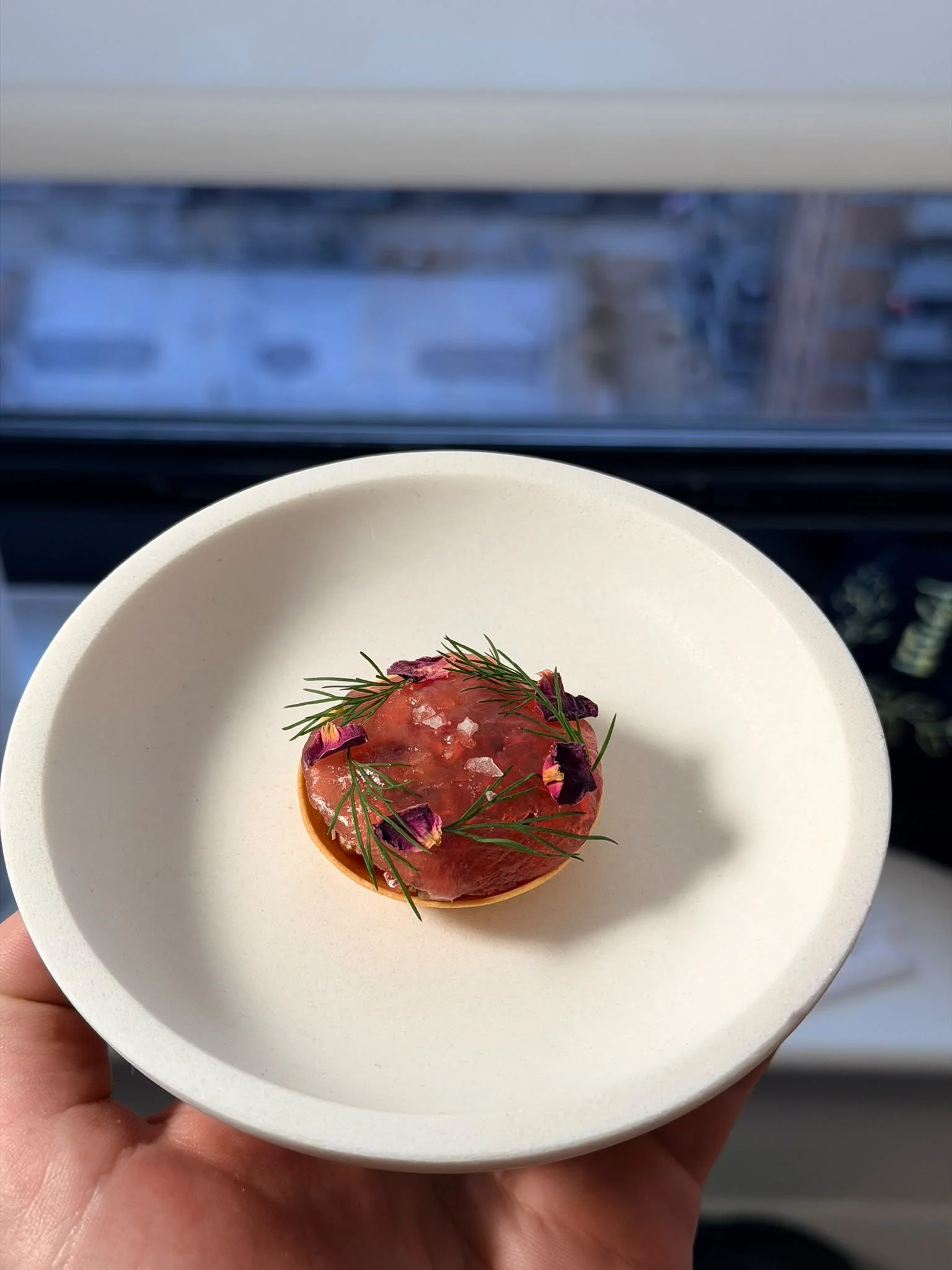 Flower-topped tartlet with fresh herbs
