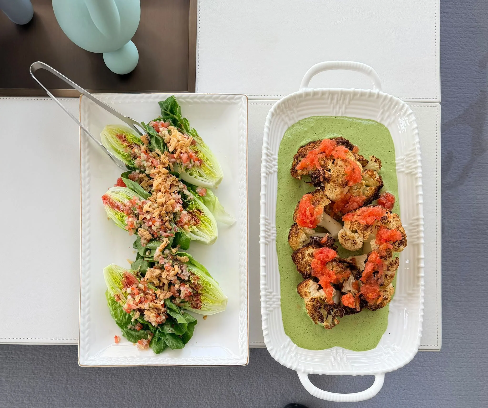 Seasonal sharing platters of dressed greens and roasted cauliflower