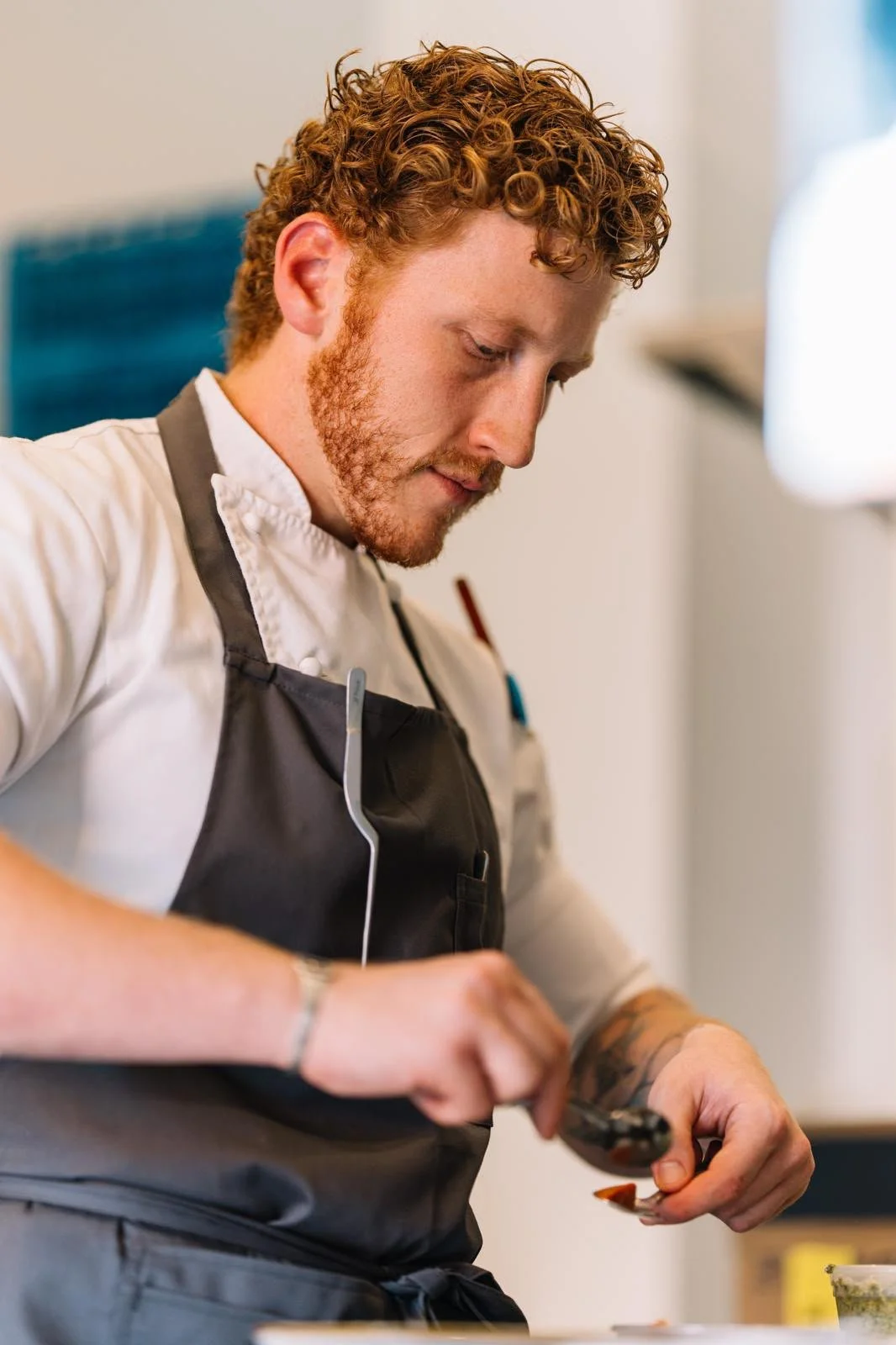 The Limonit chef carefully preparing a dish in the kitchen