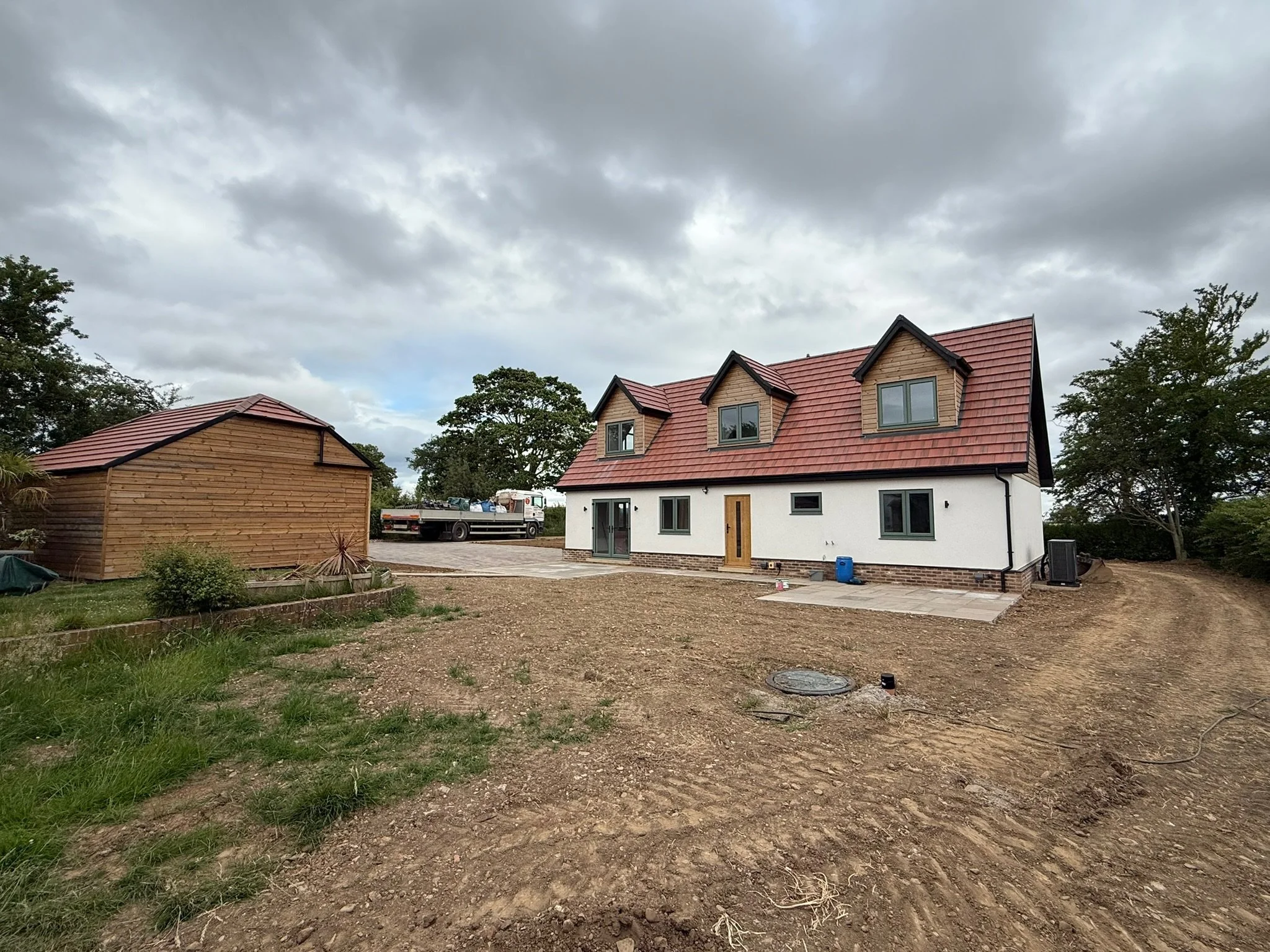 Newly built countryside house with red tiled roof