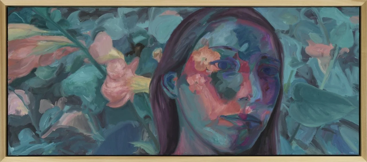 Colorful abstract oil painting of a woman’s portrait surrounded by Hawaiian pink flowers and teal foliage in a wooden frame