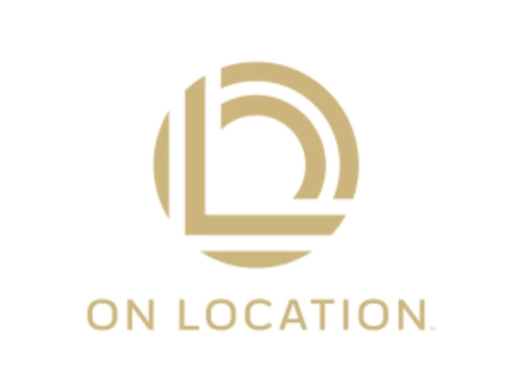 Gold geometric logo with the words “ON LOCATION” below on a white background
