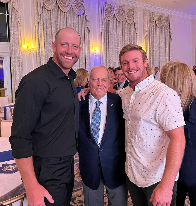 Three smiling men pose together at a formal gala, with an elderly man in a suit standing between two younger men. Jack Nicklaus, josh cassaday, nick vorbeck
