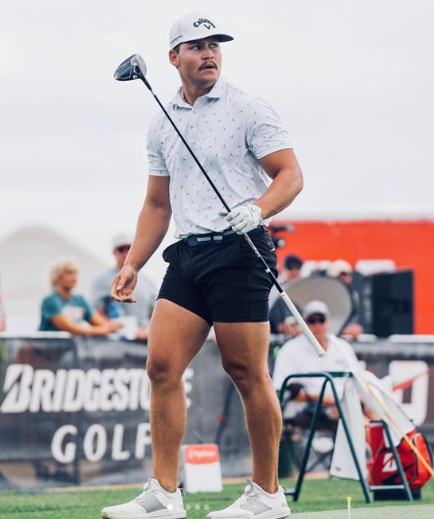 Golfer holding a club at a Bridgestone golf event