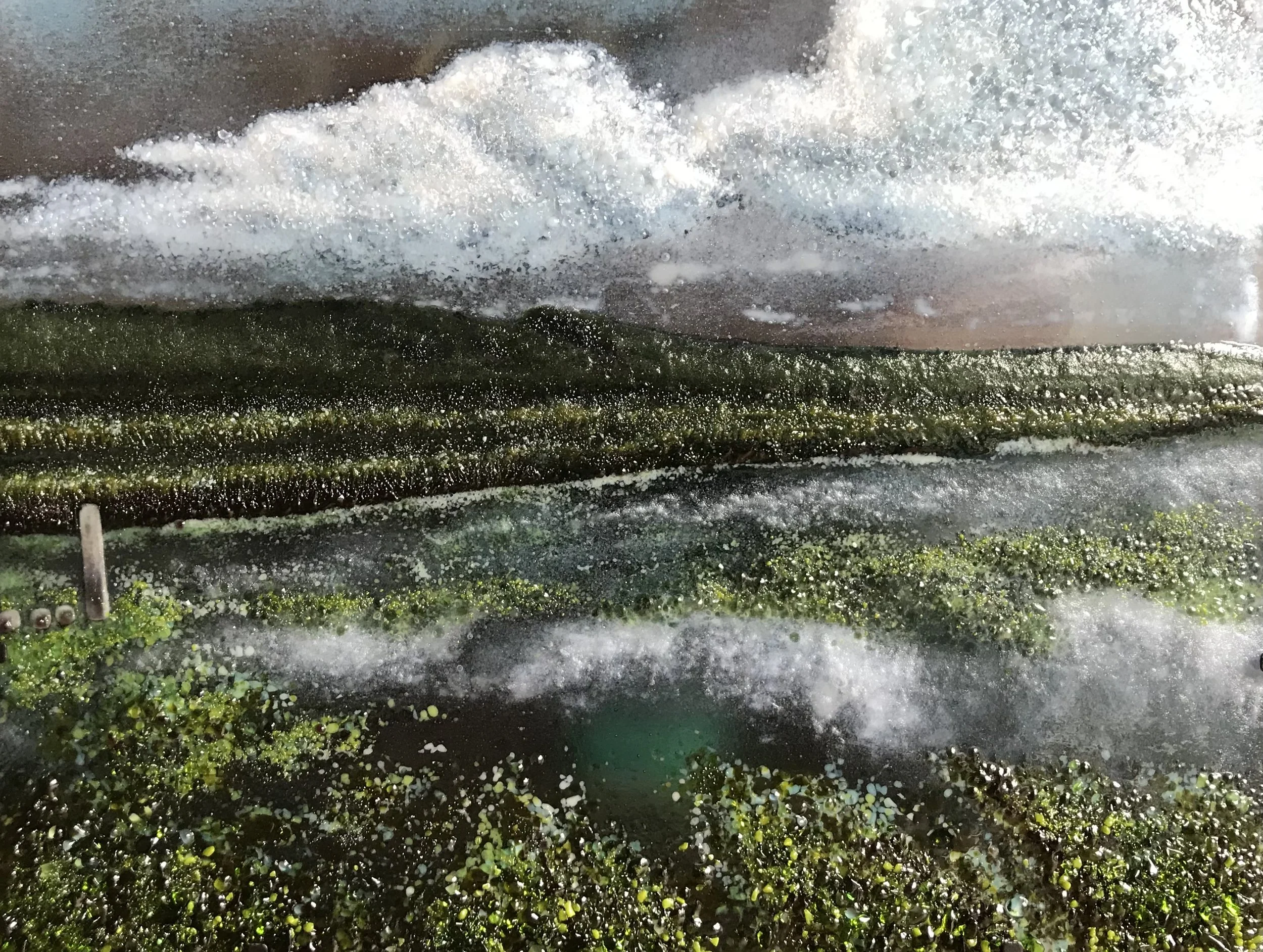 Cuckmere Haven - glass landscape of tidal river with reflection of clouds and hills