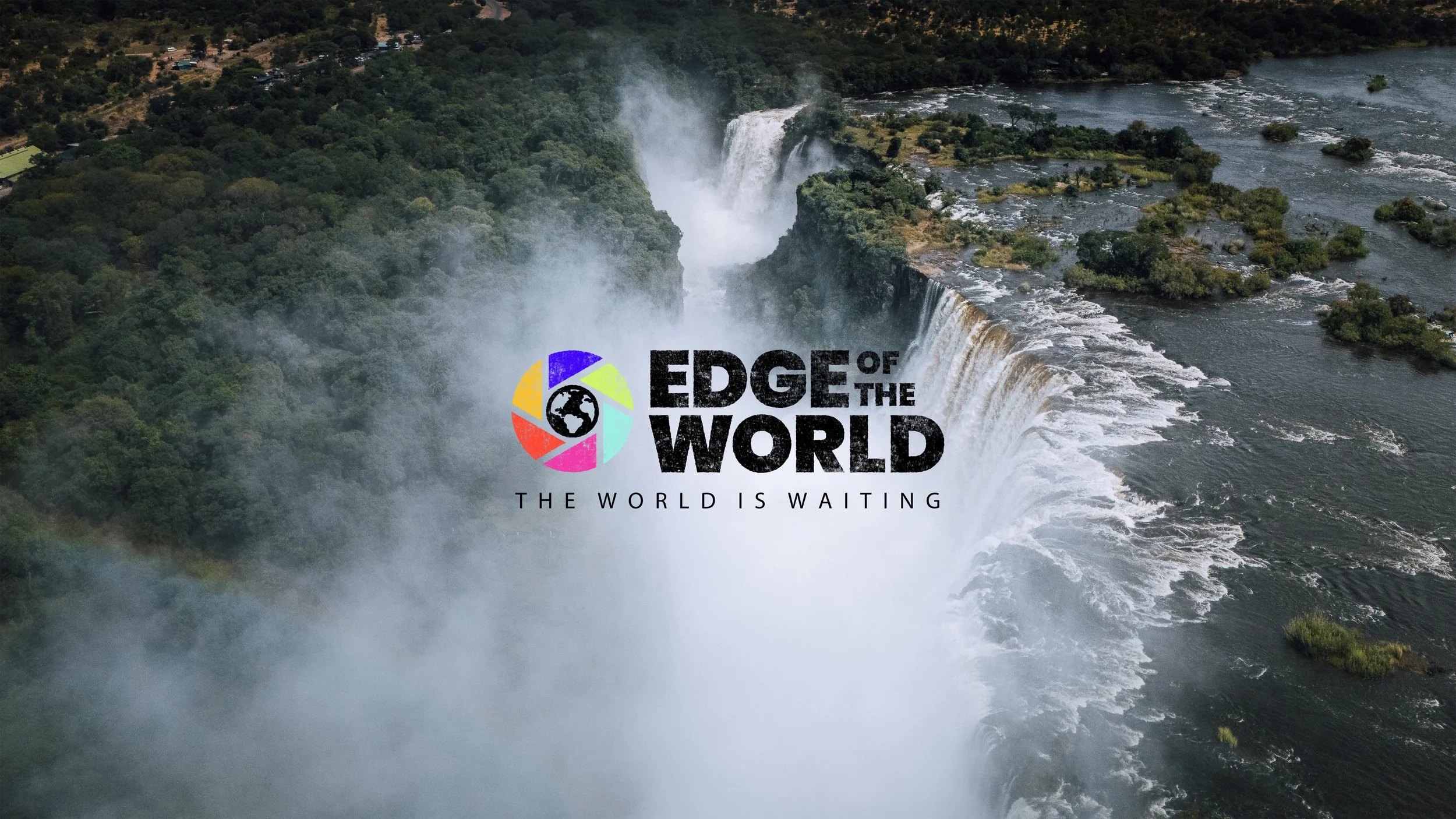 Aerial view of a powerful waterfall and misty river surrounded by lush greenery, overlaid with the Edge of the World logo and slogan.