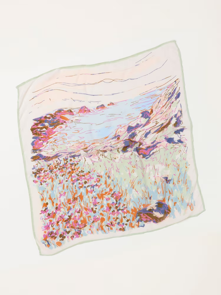 Colorful impressionist landscape illustration of a flower-filled meadow, mountain stream, and rocky hills. Hand painted surface print designs. Freelance print designer.