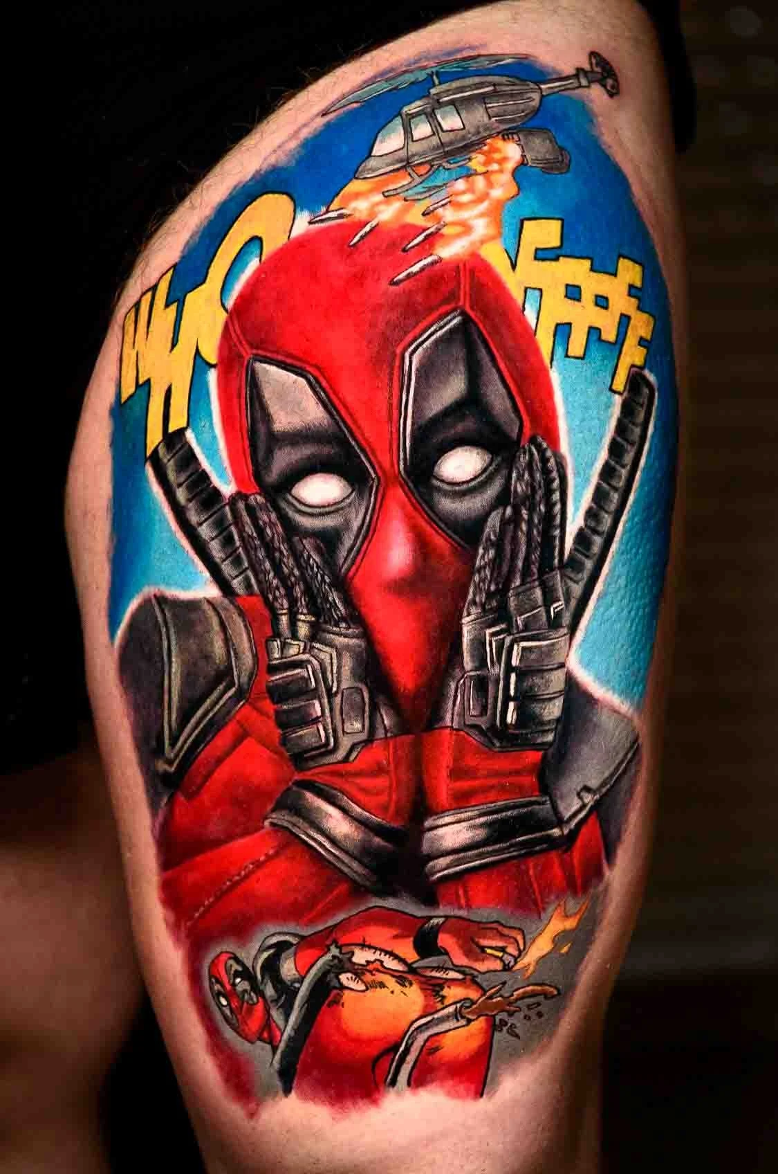 Color realism Deadpool tattoo with a red mask and an explosion in the background.