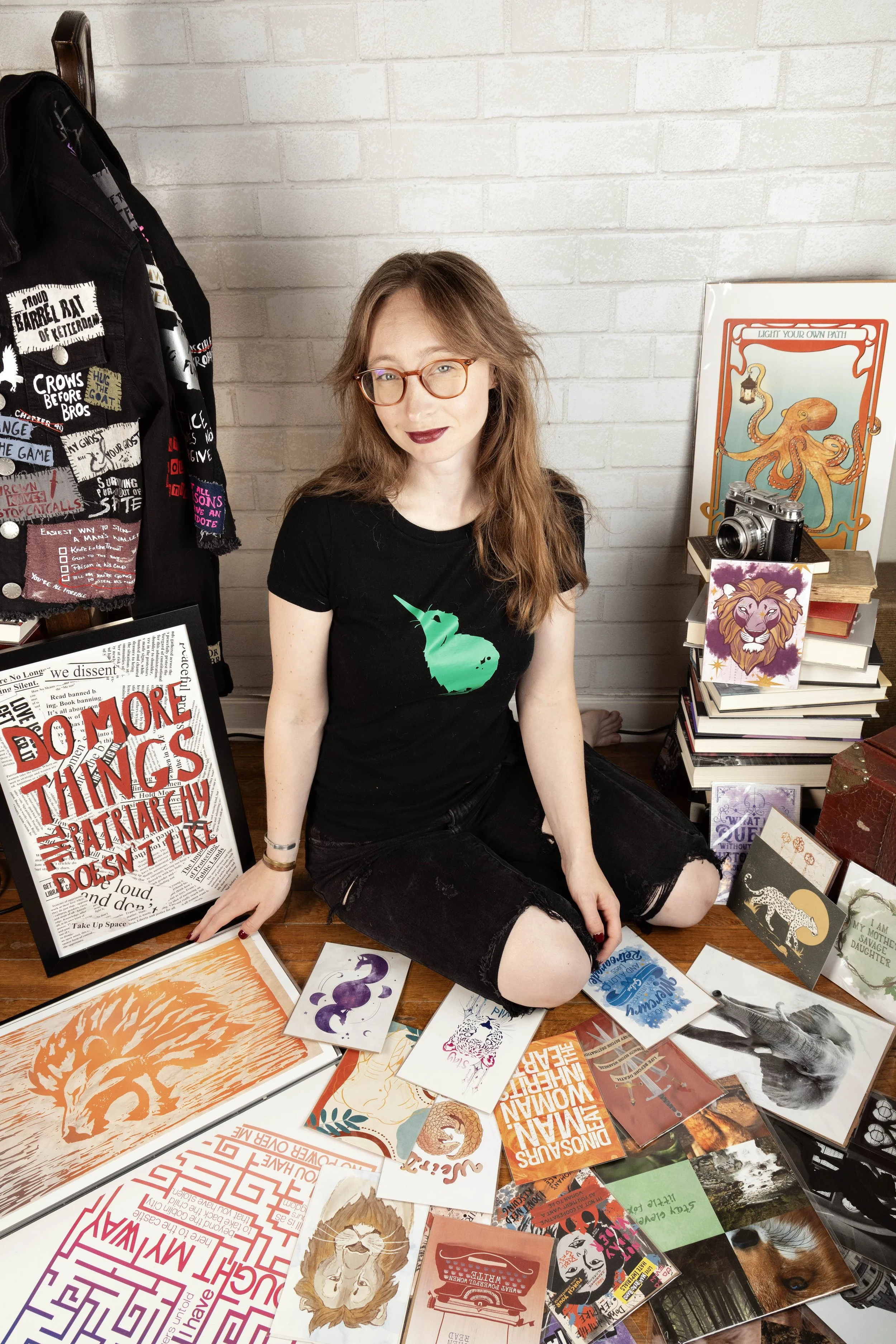 Girl surrounded by art she made