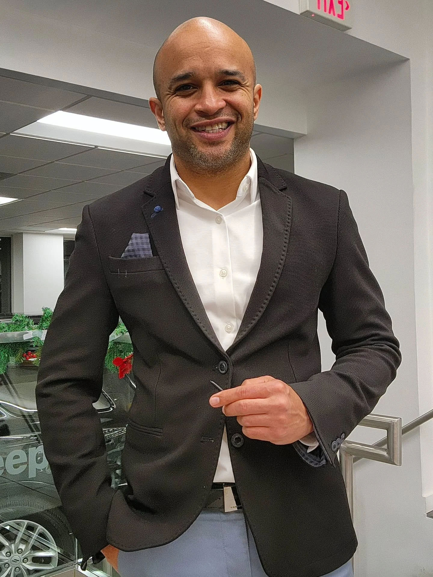 Charlie Cabrera, automotive sales professional at Auto by Charlie, in a Bronx, NY car showroom.