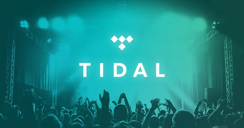 TIDAL music event logo over a teal-lit concert crowd with raised hands