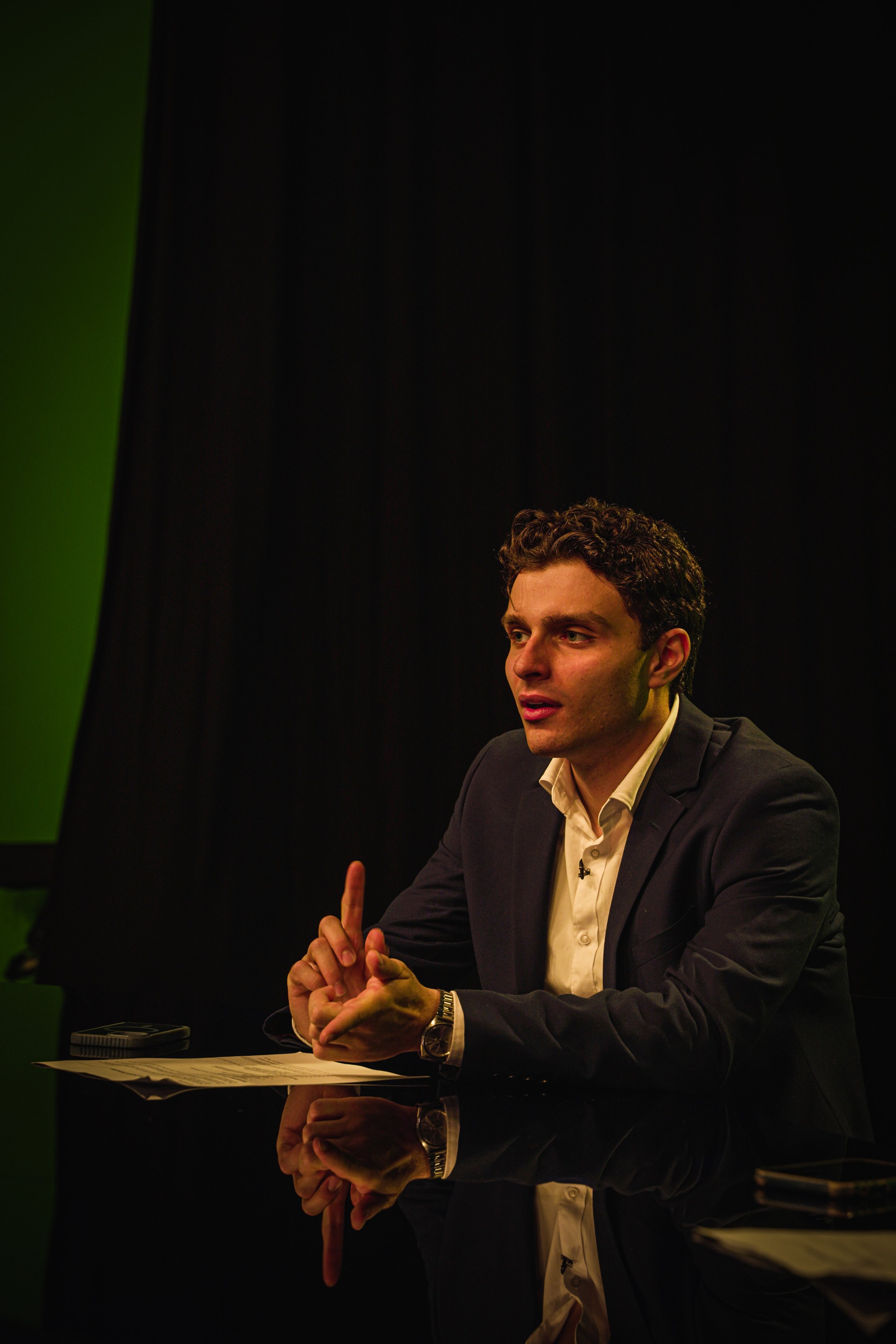 Kosmas (Writer) Making his cameo as a news reporter in the film