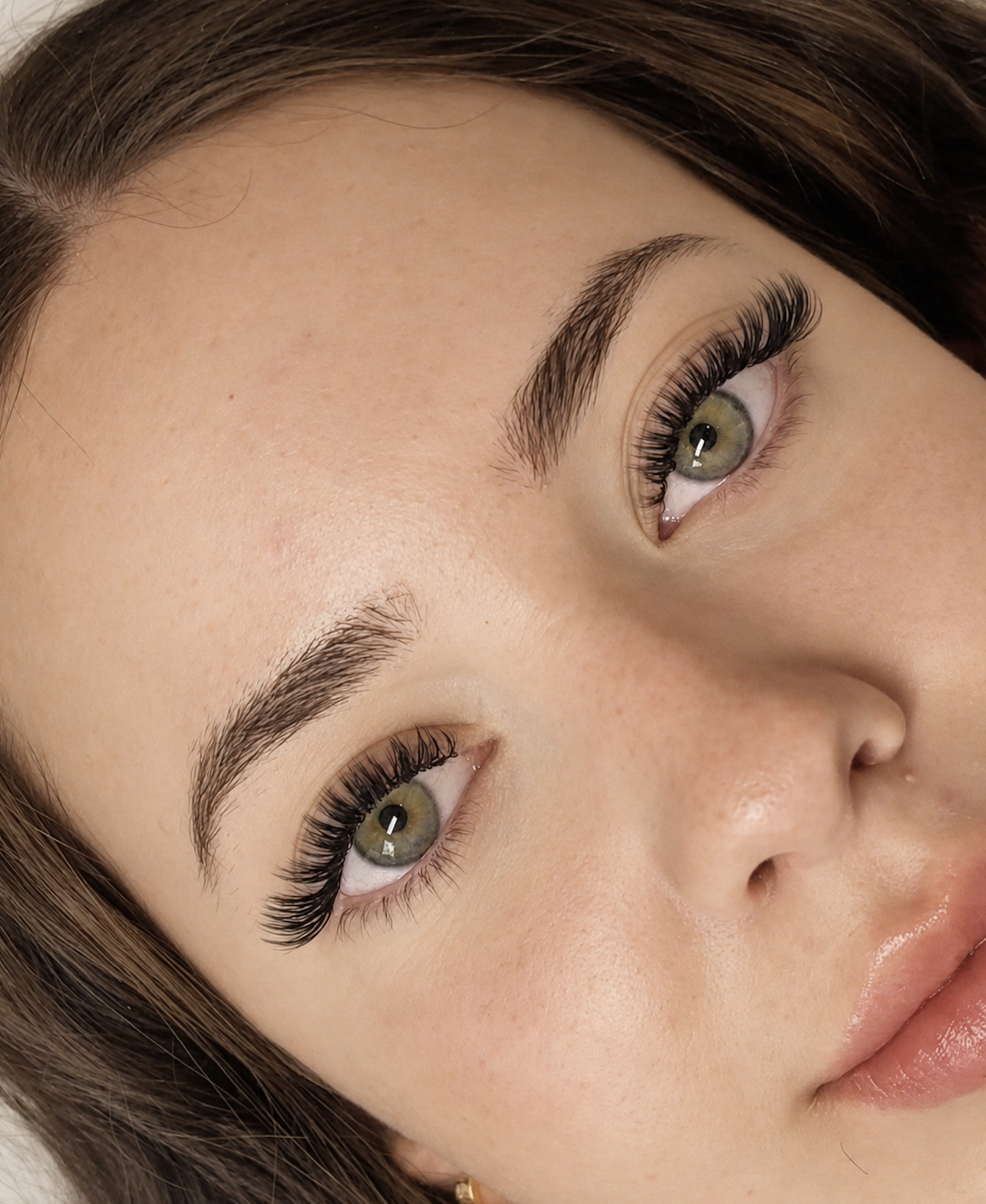 Close-up of a client’s lash extensions and shaped brows.