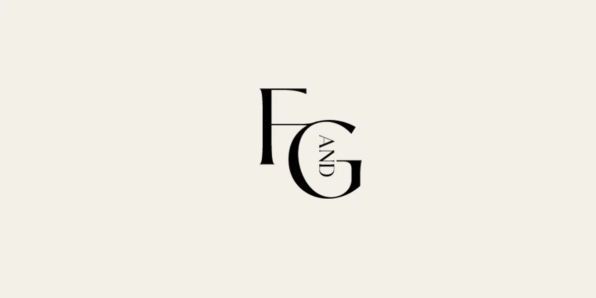 Minimalist black FG monogram logo with the word “AND” arranged vertically on an off-white background