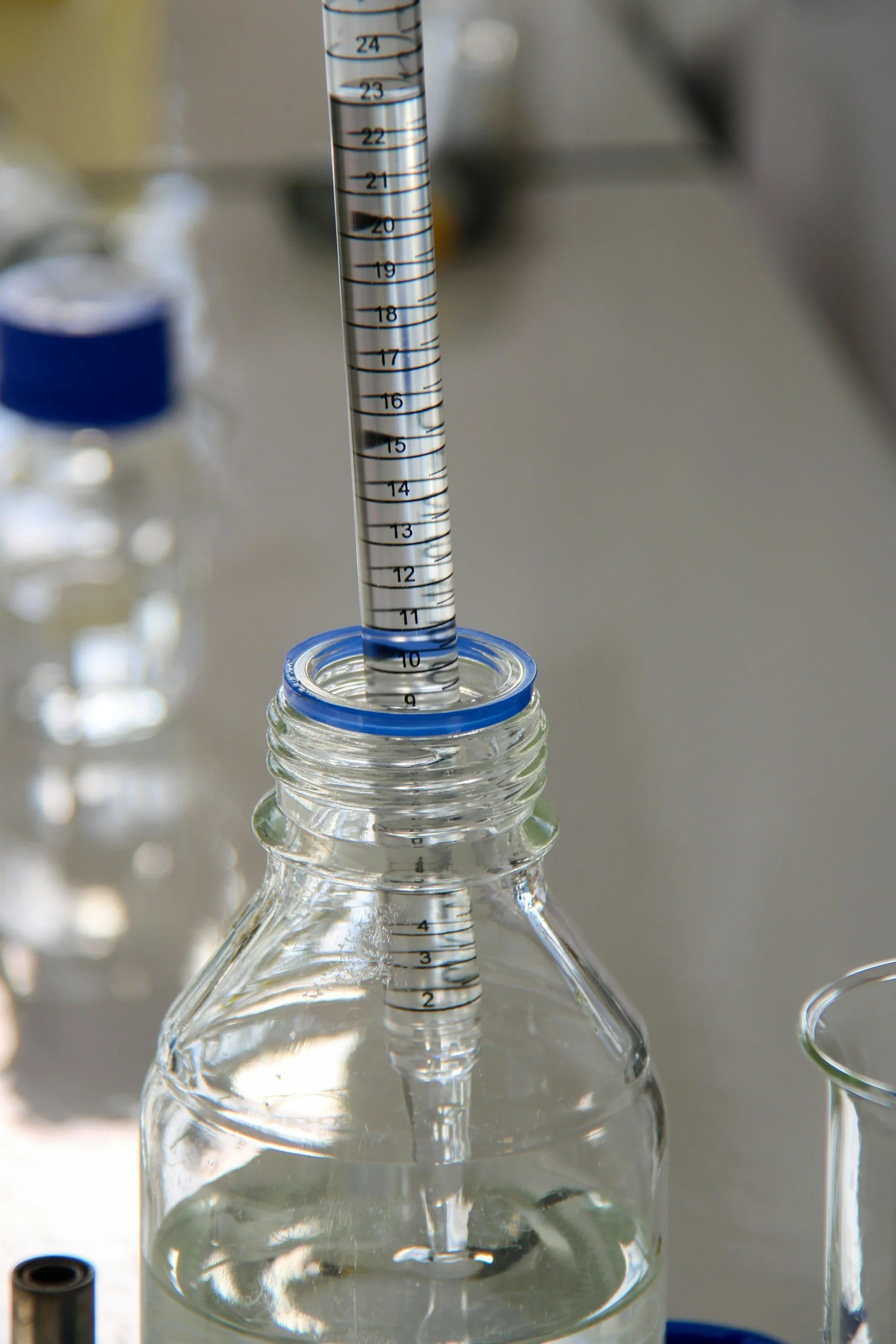 Graduated pipette in a laboratory bottle