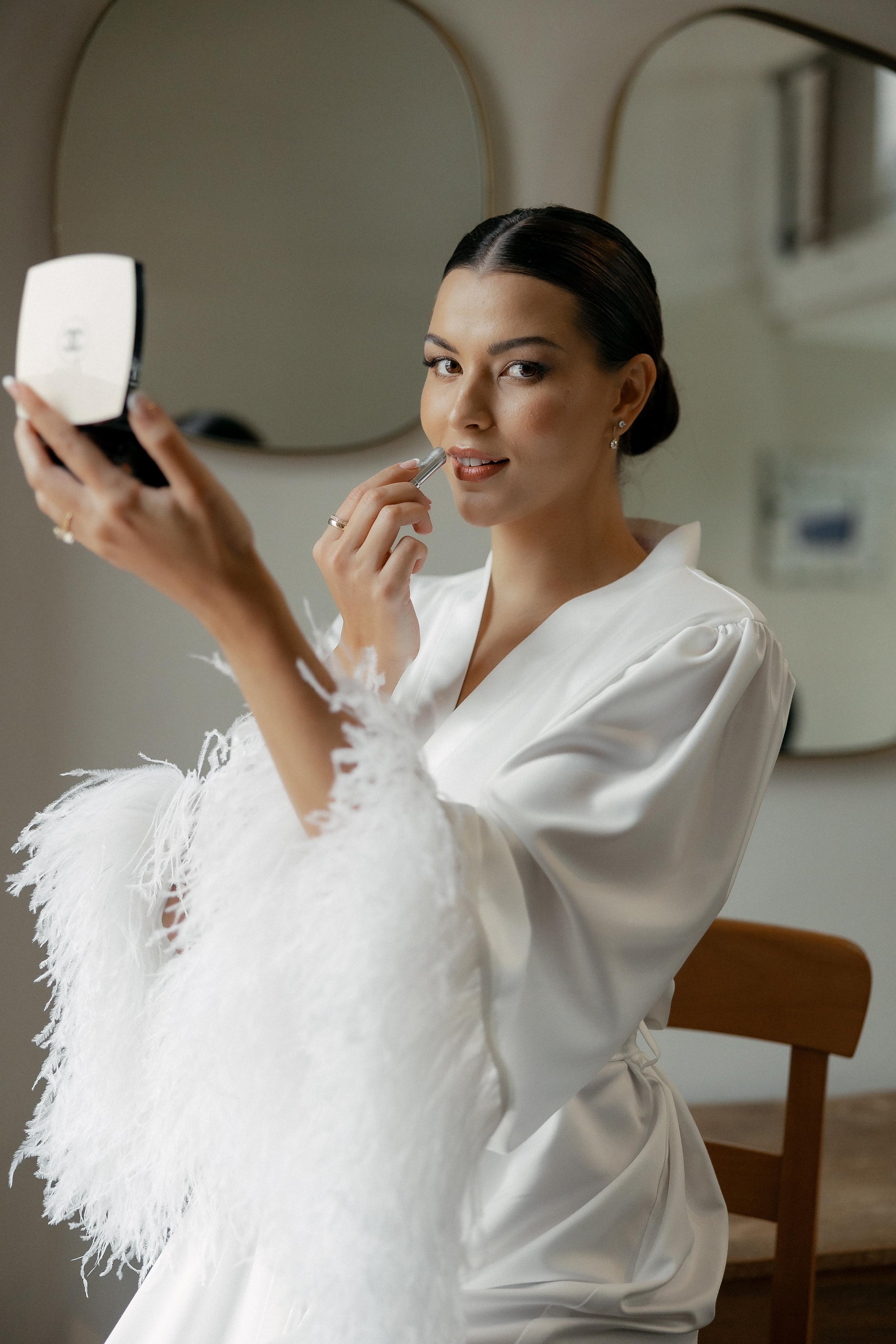 bride holding chanel makeup palette