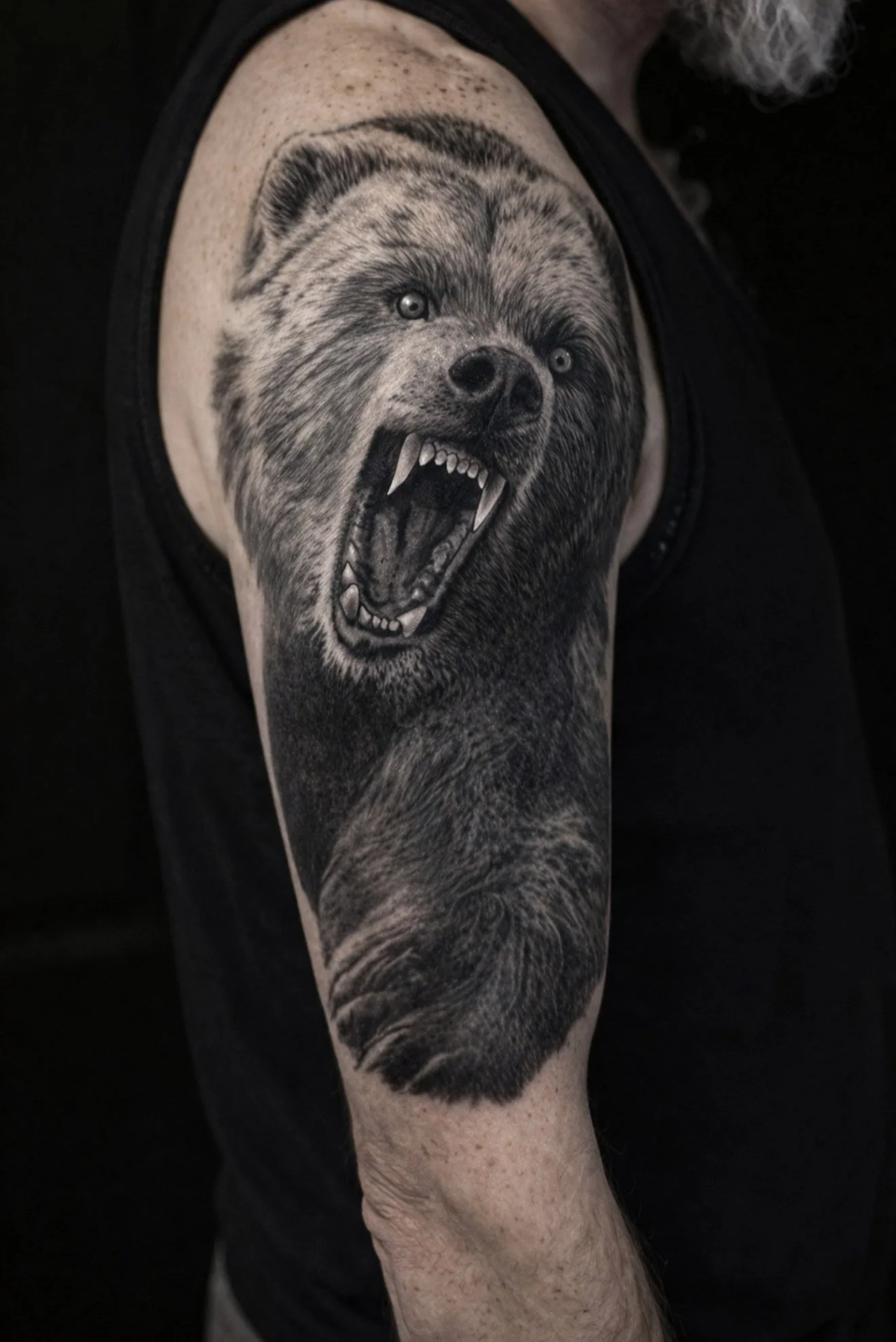 Black and grey realism bear cover-up.
