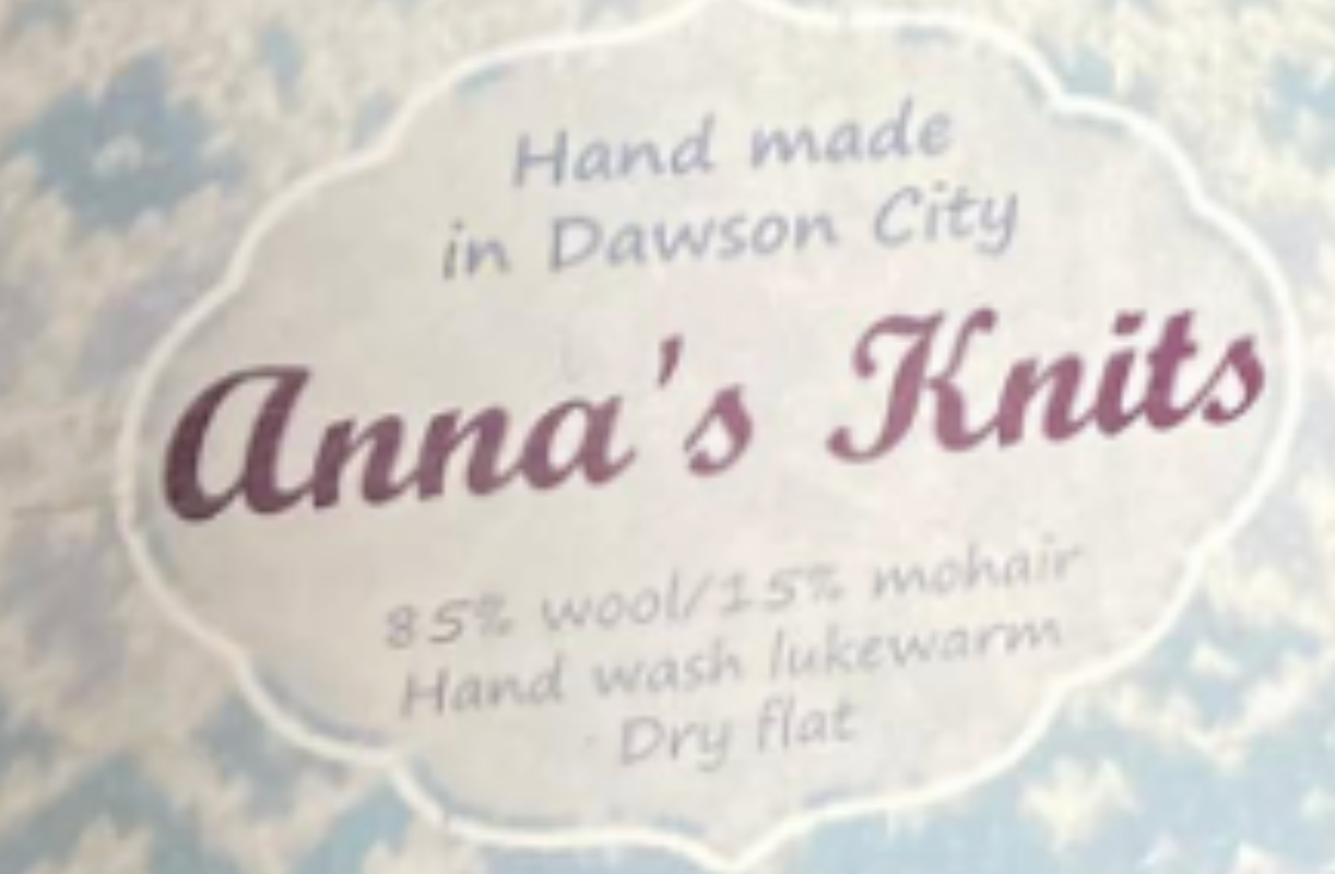 Handmade Anna's Knits label from Dawson City, listing 85% wool, 15% mohair, hand wash lukewarm, and dry flat.