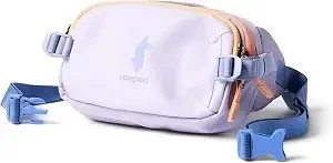 Cotopaxi Allpa X 1.5L Hip Pack in Moonbeam, with a light lavender body and blue strap.