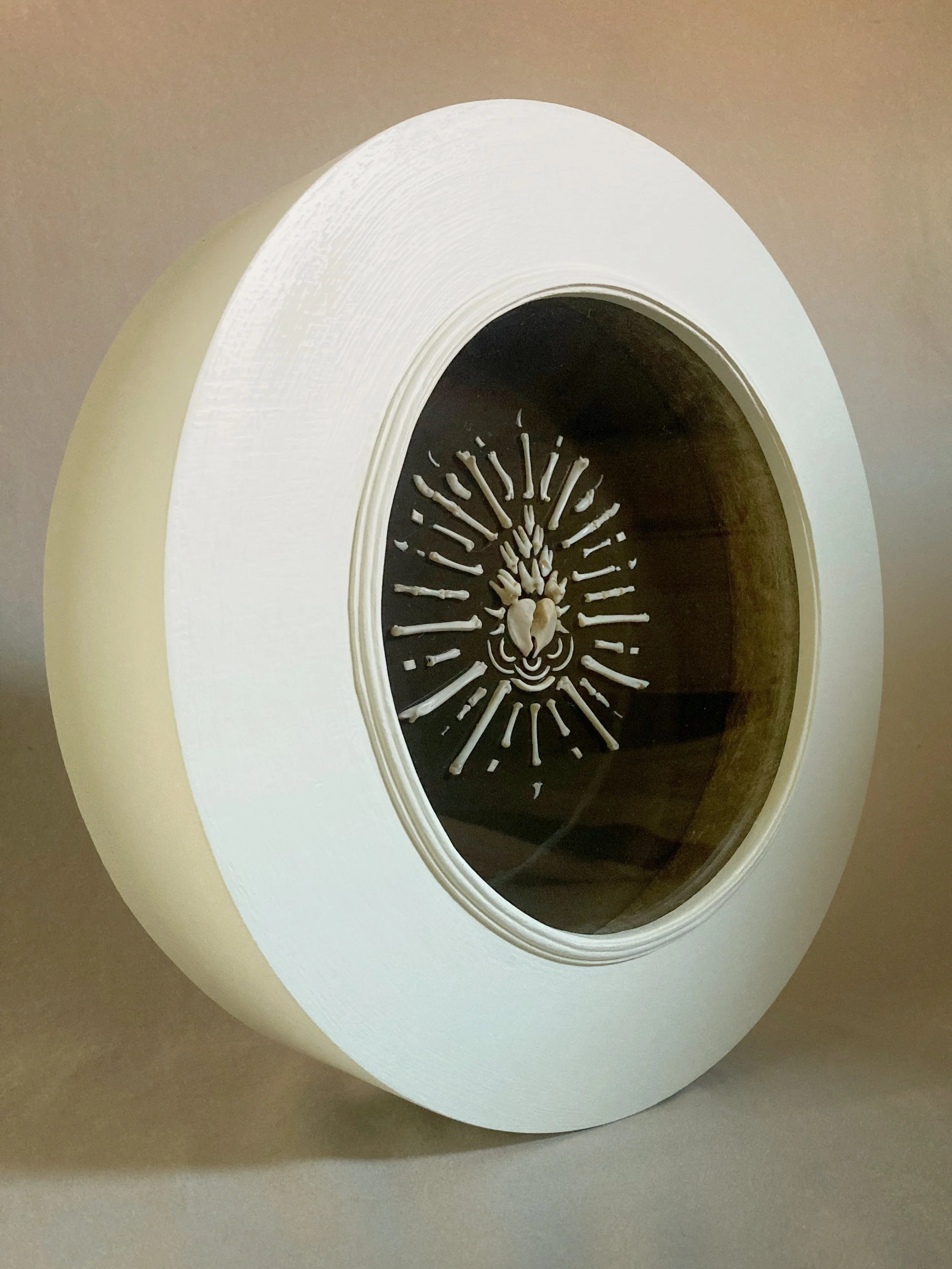Close-up of a white toilet decorated with a human skeleton design inside the bowl.