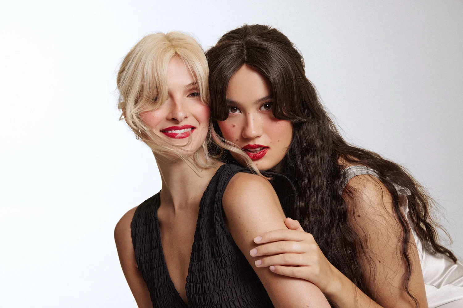 Two models in Luxy curtain bangs