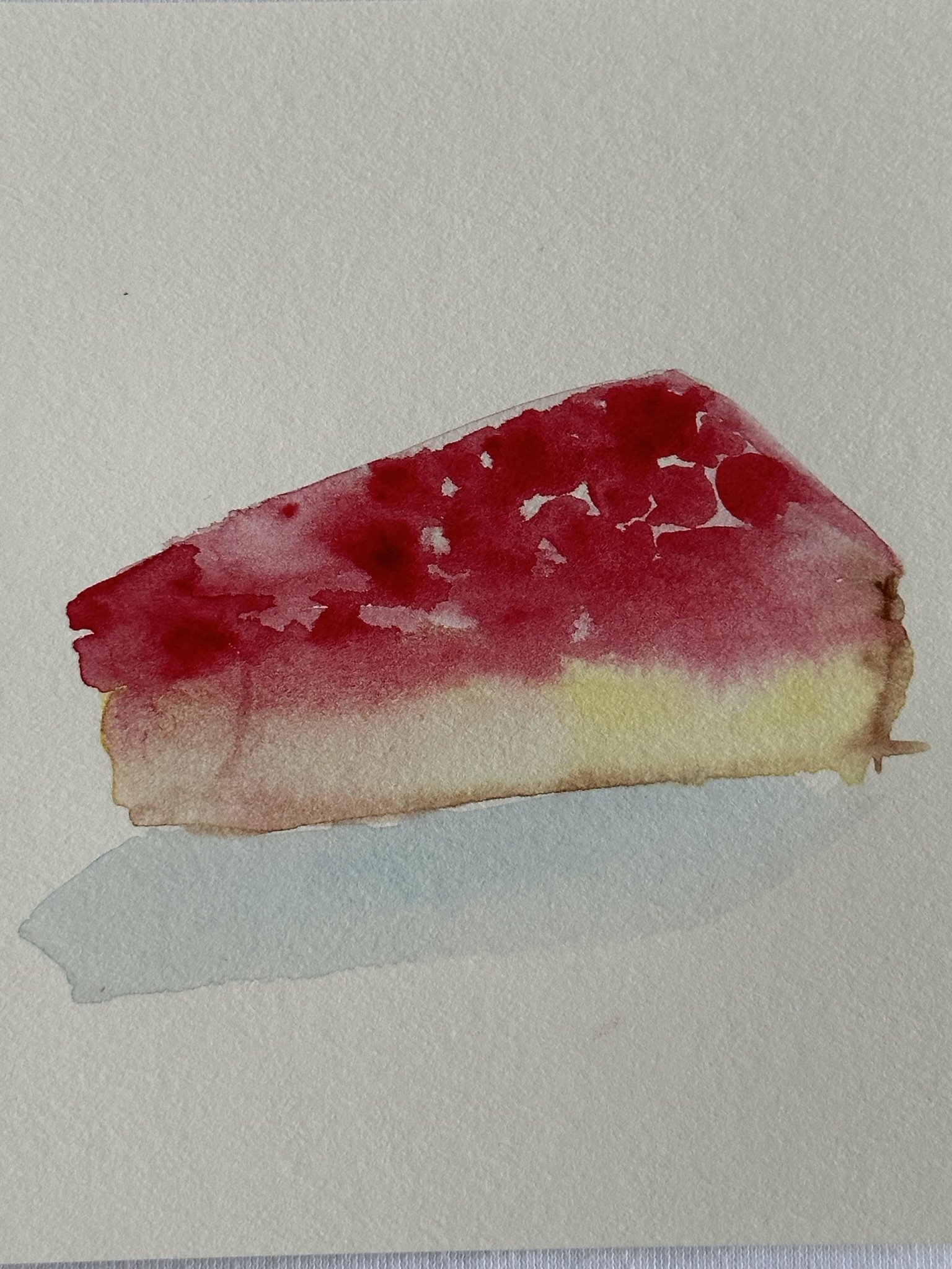Watercolor painting of a strawberry cheesecake slice on watercolor paper.