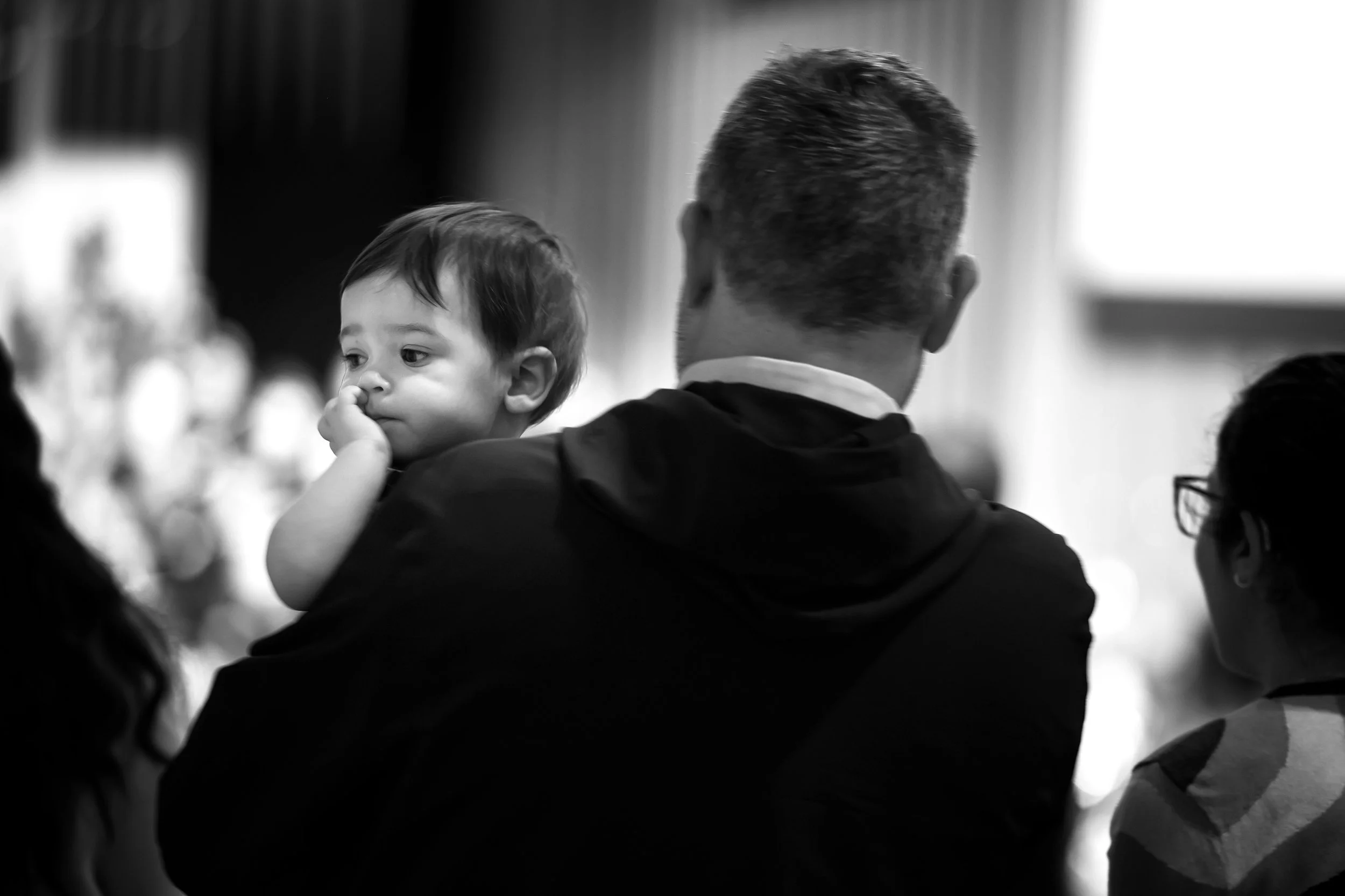 SOLI - A young boy takes in the music with his parents from the back row of the North Campus Sanctuary. 