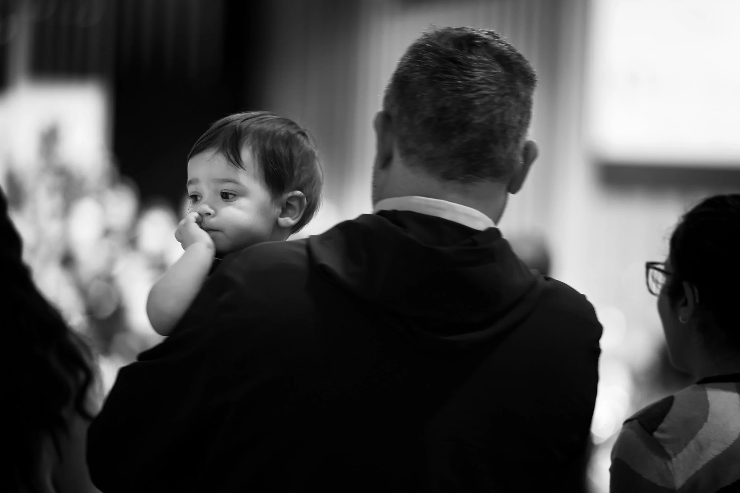 SOLI - A young boy takes in the music with his parents from the back row of the North Campus Sanctuary. 