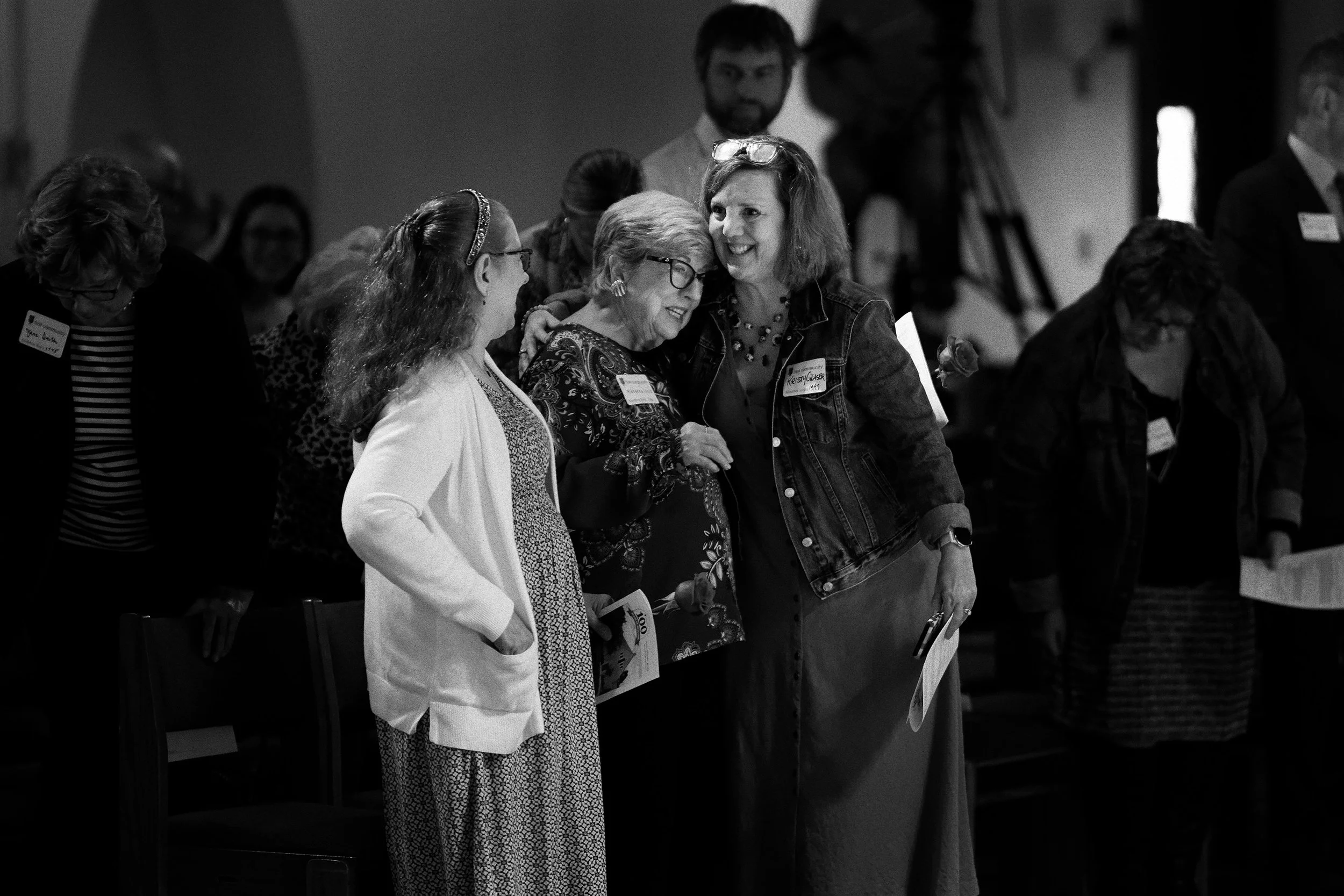 100 YEARS - Kristy Glaser, Director of Member Engagement, greets Rebecca Hord with a warm embrace.