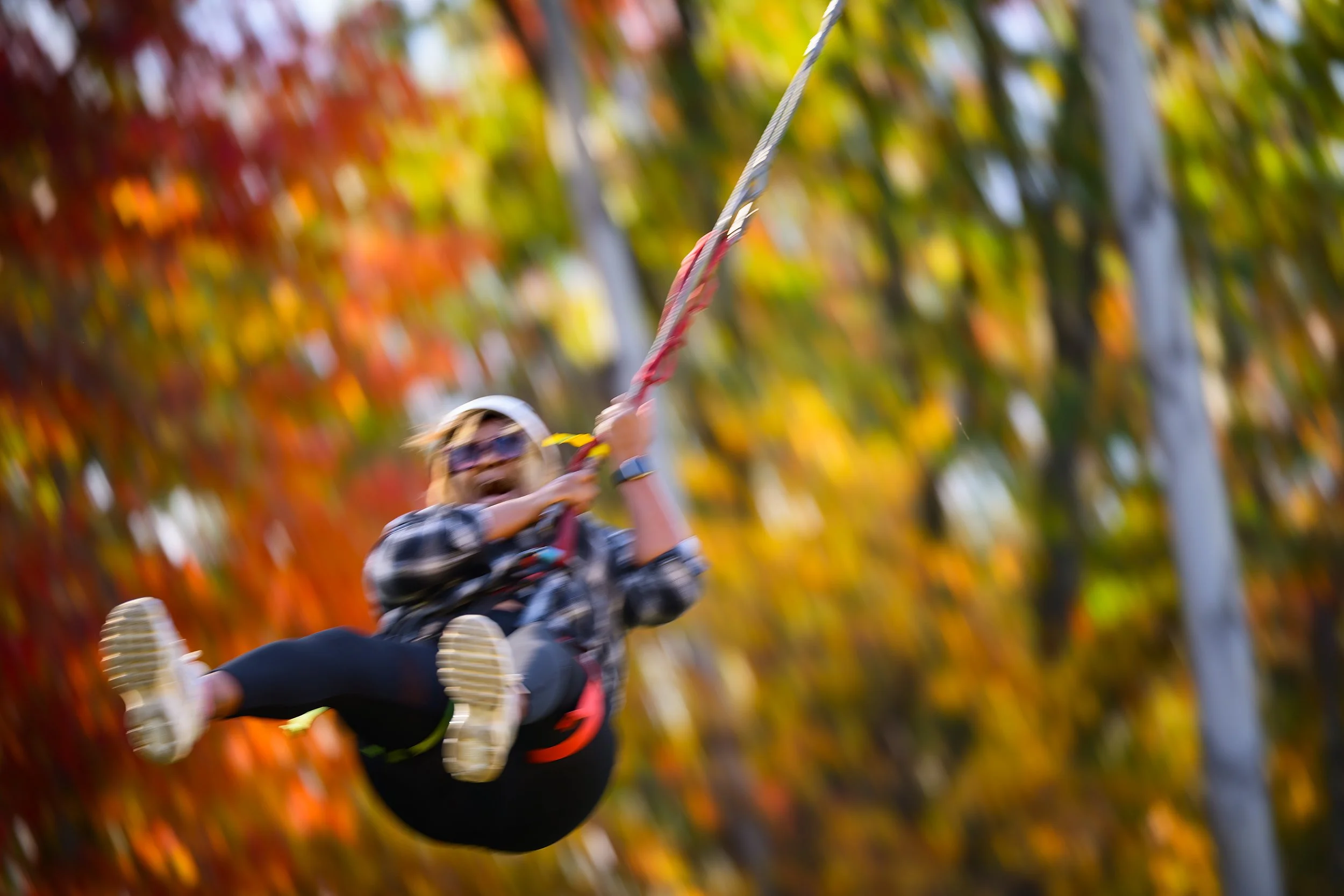 AKITA - A Camp Akita adult visitor screams her way through the giant swing during the annual Family Fun Day on Sunday, October 25. The 1,200 acre camp, located in Hocking County, Ohio, is open one Sunday every fall after worship to hiking, boating, p