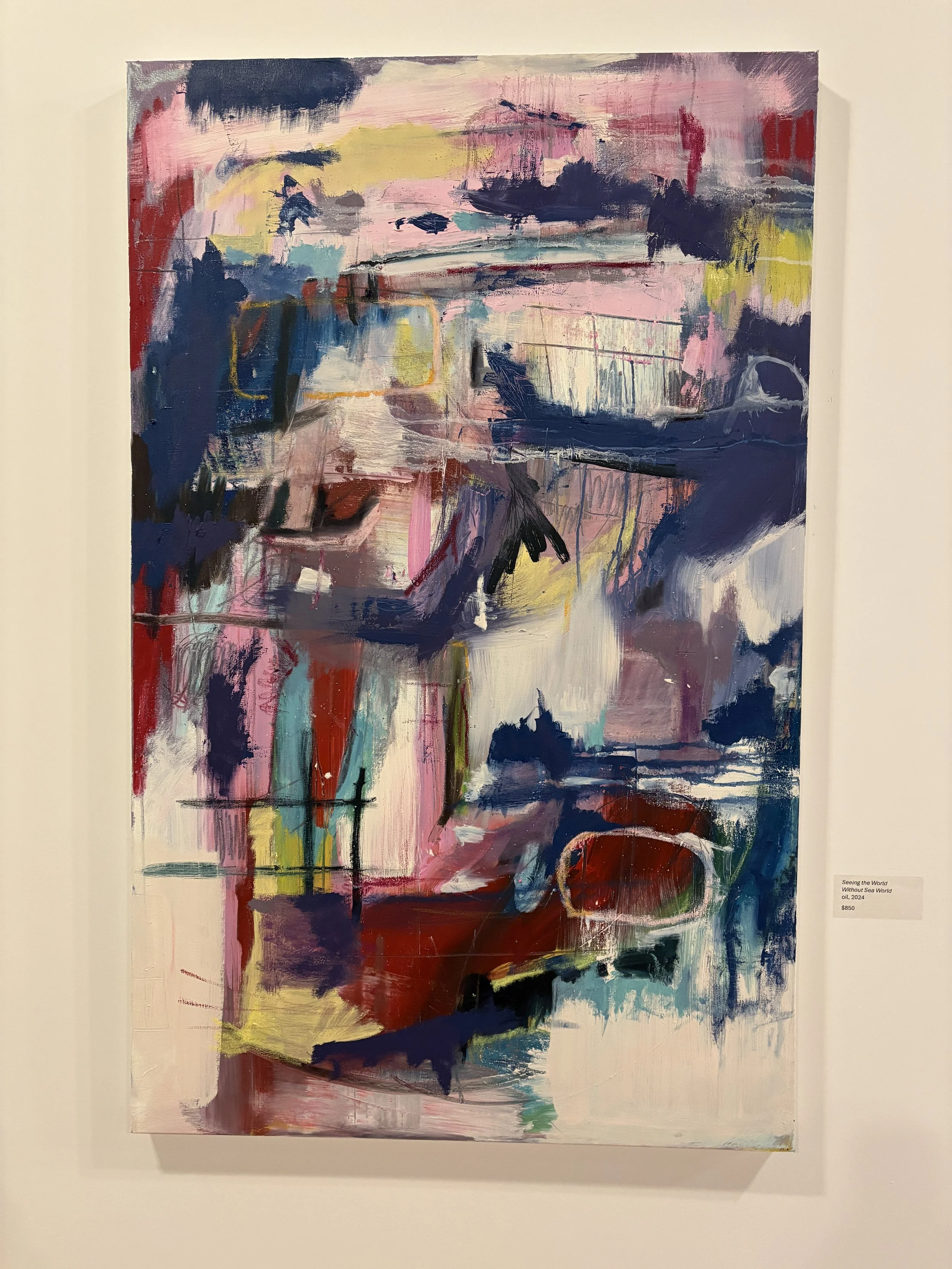 Abstract mixed-media painting titled “Without Sea World,” featuring layered pink, navy, red, teal, yellow, and purple brushstrokes.
