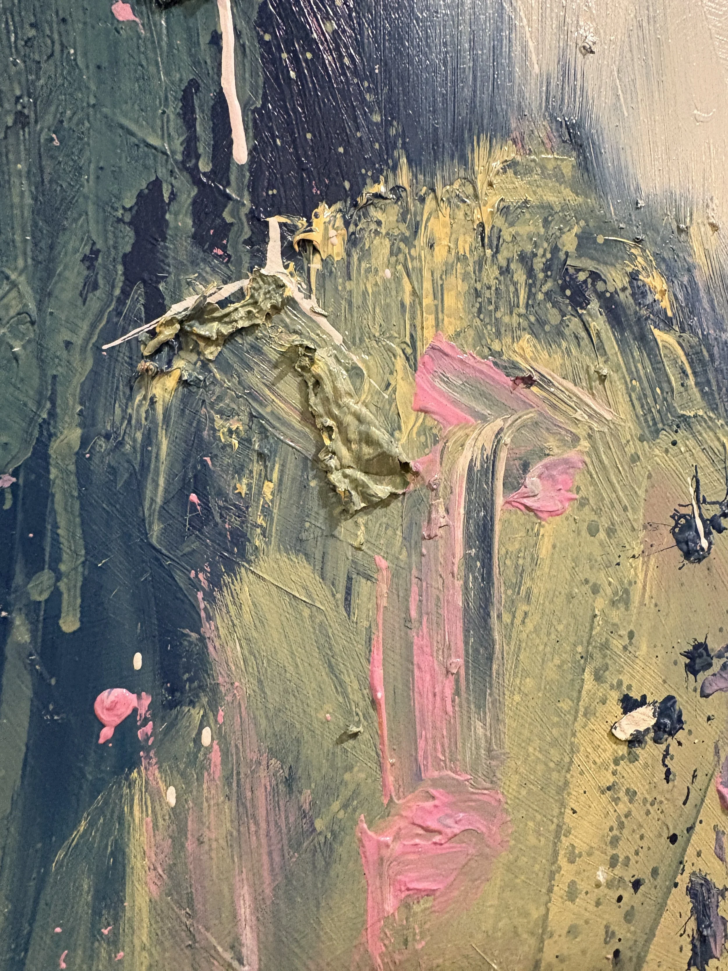 Abstract close-up of layered green, black, gold, and pink brushstrokes on a textured painted surface