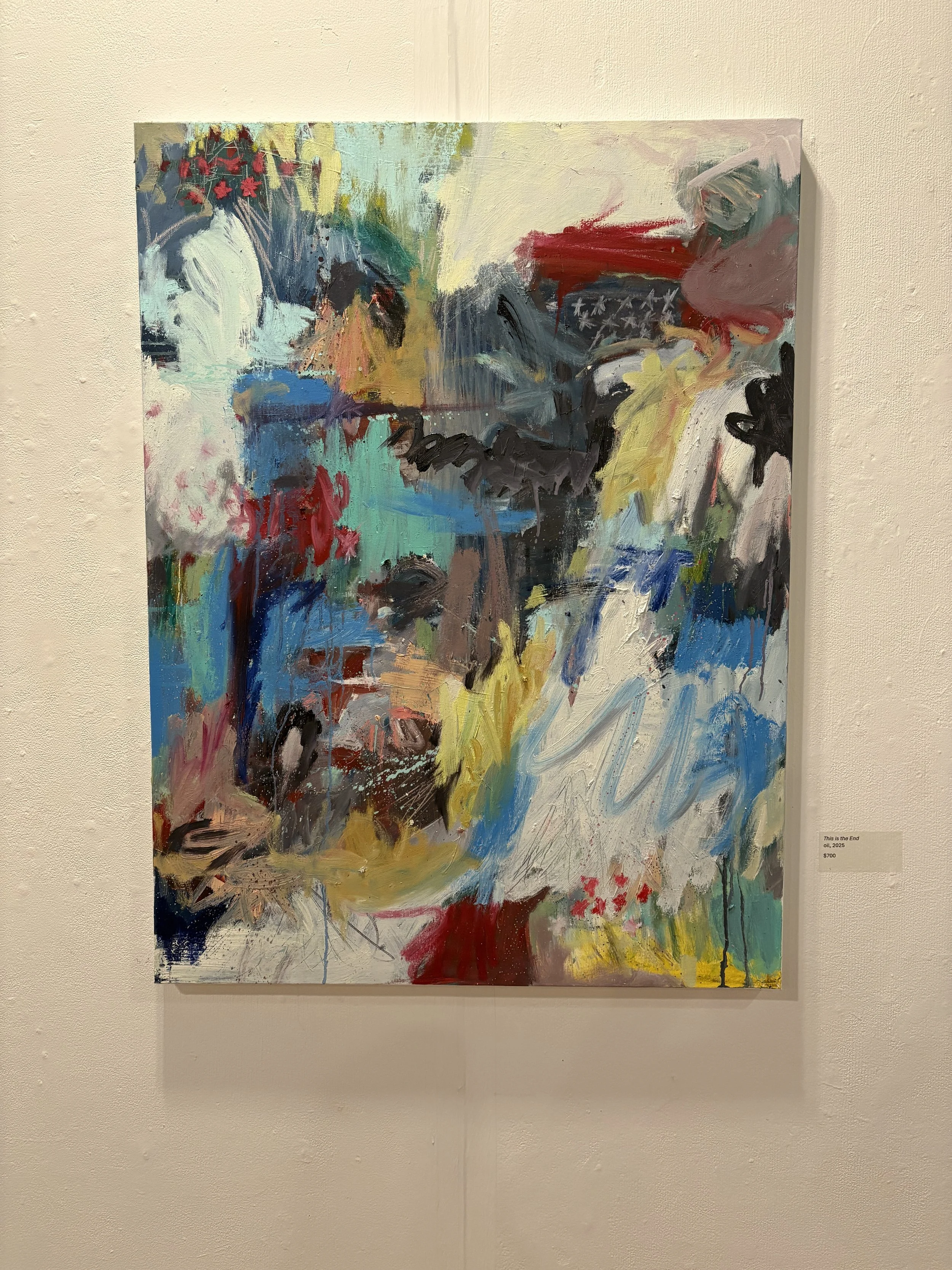 Abstract mixed-media painting titled “This is the End” displayed on a gallery wall, featuring vibrant brushstrokes in blue, red, yellow, white, and black.