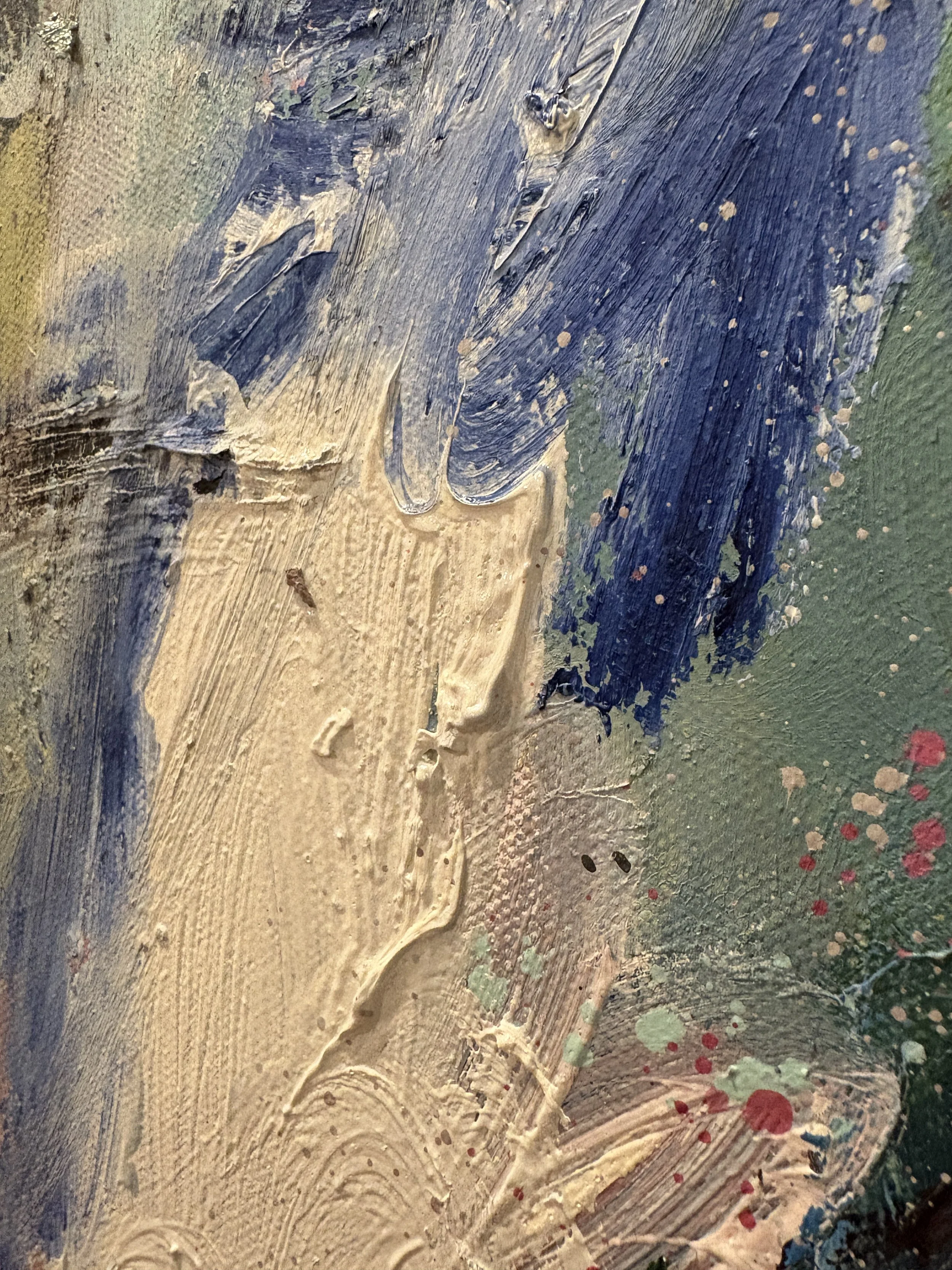 Close-up of a textured abstract painting with layered tan, navy blue, green, and red brushstrokes.