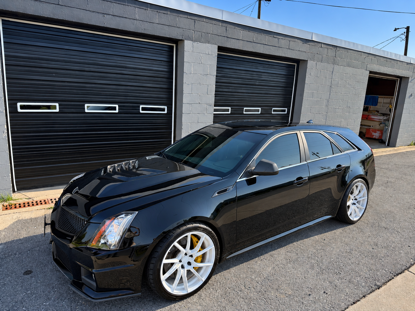 Black Cadillac CTS-V wagon outside Detail Werkz in Frederick