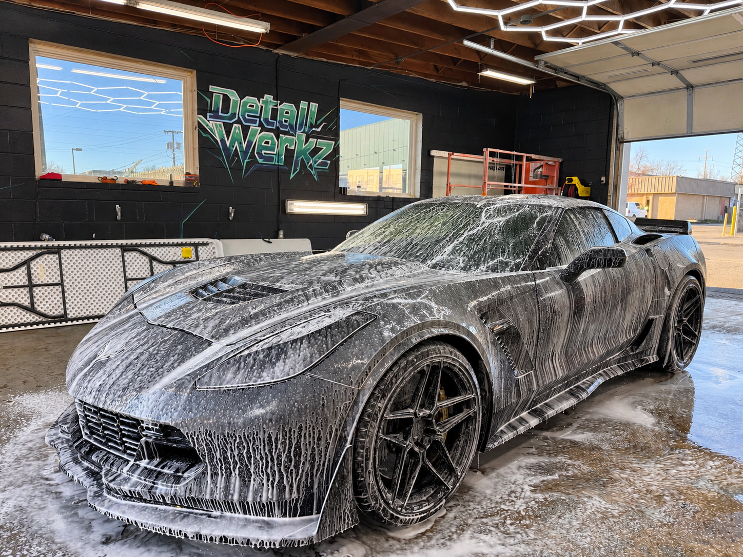 Customer Corvette receiving a foam wash at Detail Werkz